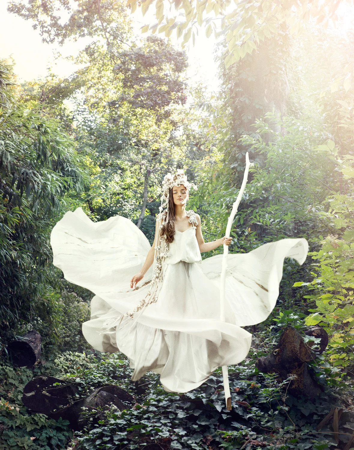 woman floats in flowing dress in this inspiring conceptual fashion photo by conceptual photographer Hanna Agar