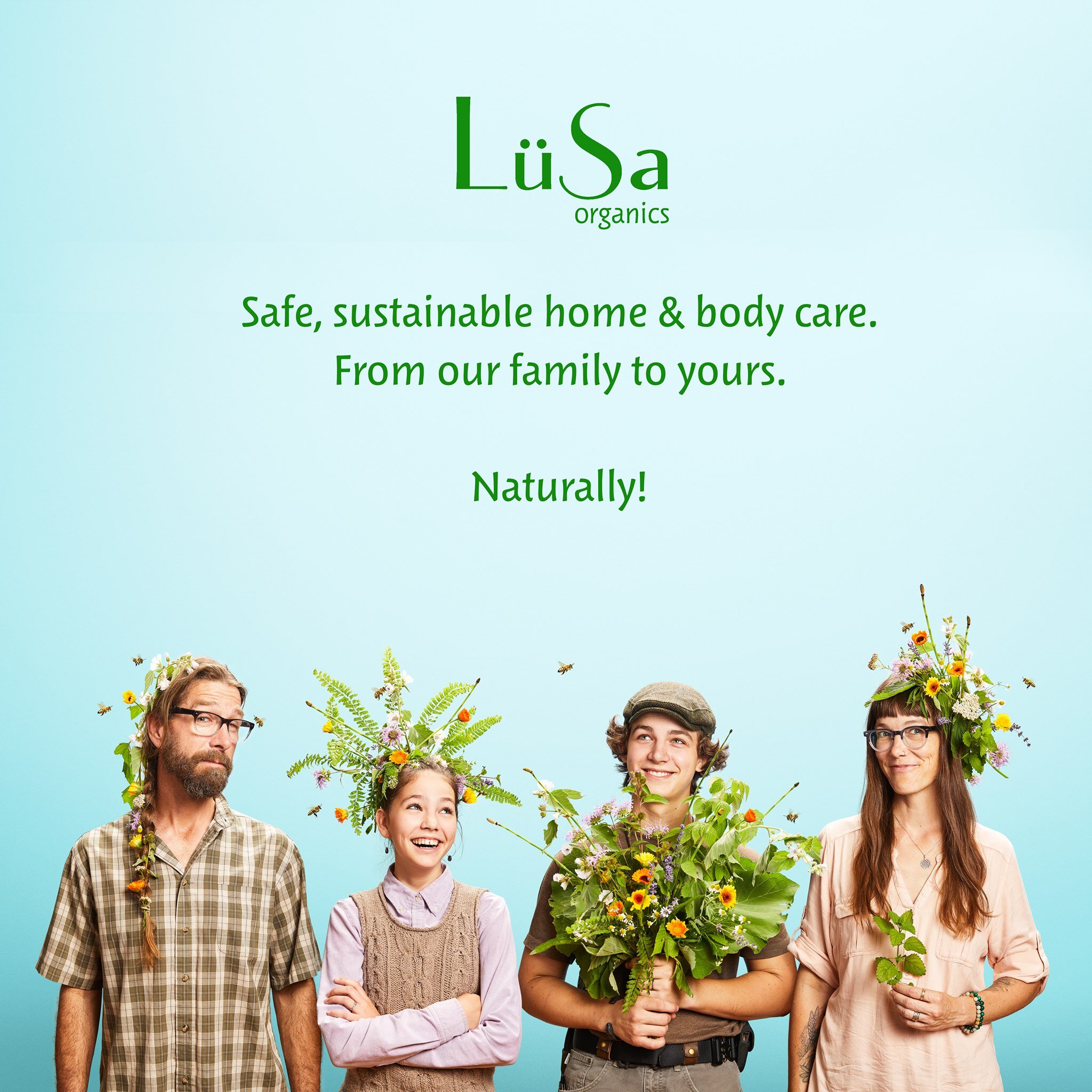quirky commercial family portrait promoting home and body care company LuSa Organics shot in studio with herbal crowns and bouquet