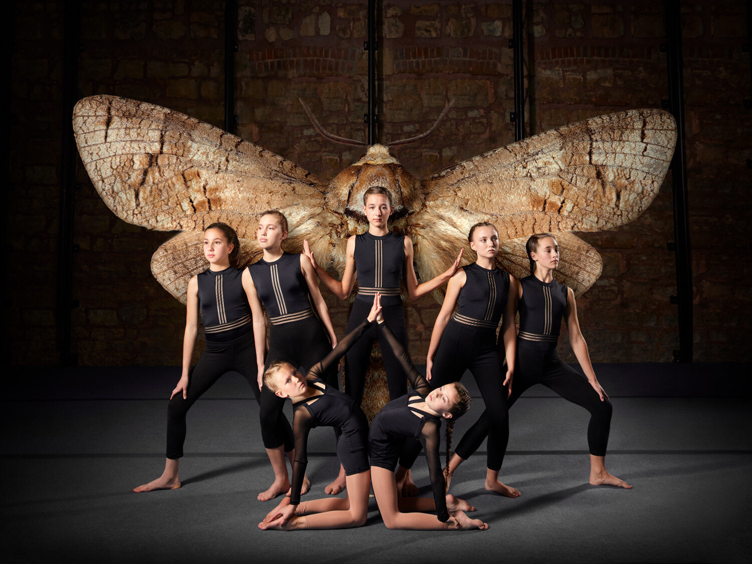 conceptual photo of circus performers and giant moth for Bricolage Cirkus created by creative photographer Hanna Agar