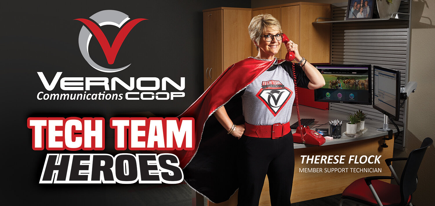 Member support technician in red cape posed as superhero for a creative advertising campaign created for billboard ads for Vernon Communications Coop in Westby, WI.