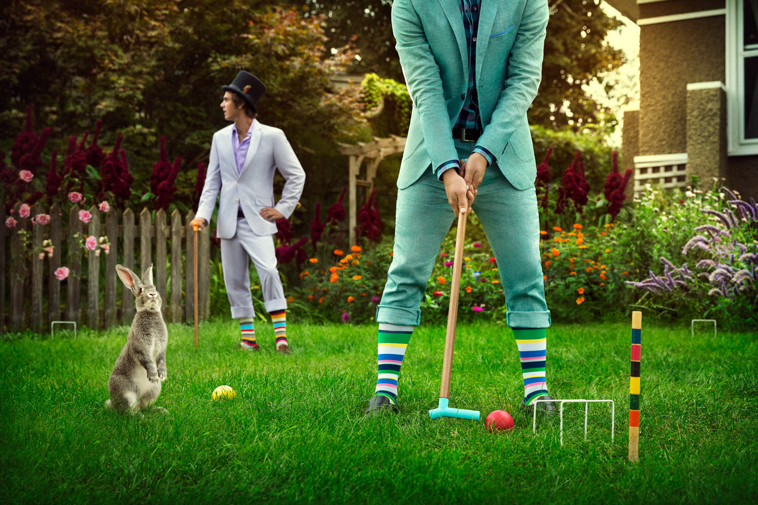 conceptual product photography: bunny and gentlemen in suits playing crocket with walking sticks and compression socks from Top &amp; Derby.