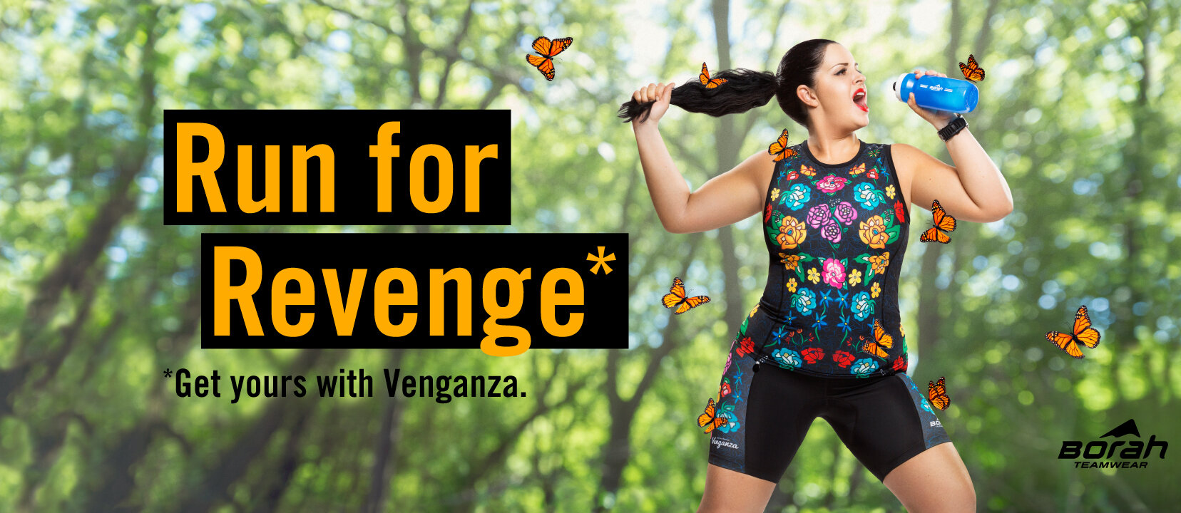 Creative product photography: female athlete surrounded by butterflies wearing floral triathlon kit by Venganza sings into her water bottle on her run through the woods.