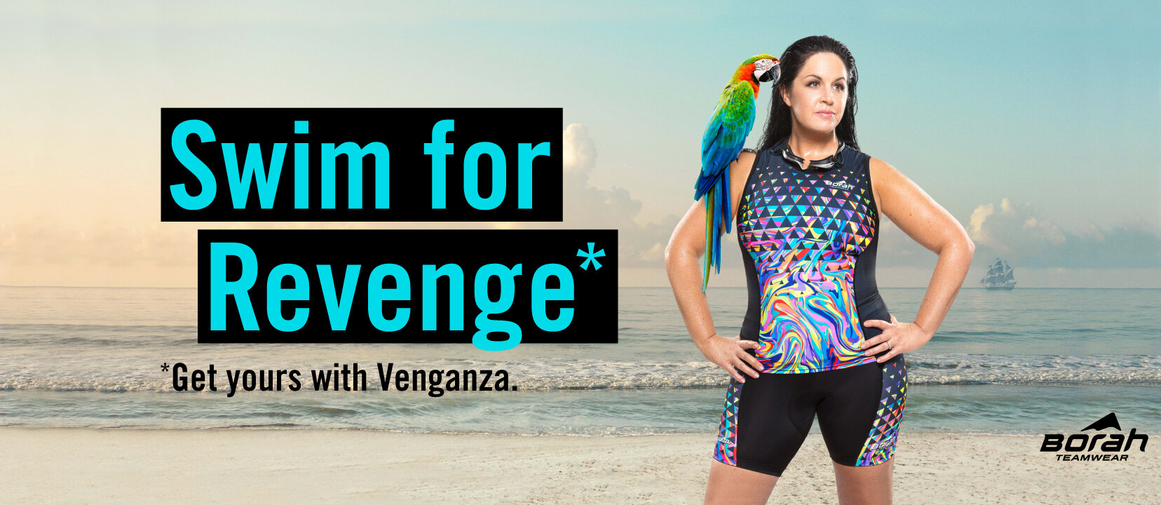 Creative product photography: female athlete wearing colorful triathlon kit by Venganza stands wet on beach with a parrot on her shoulder.