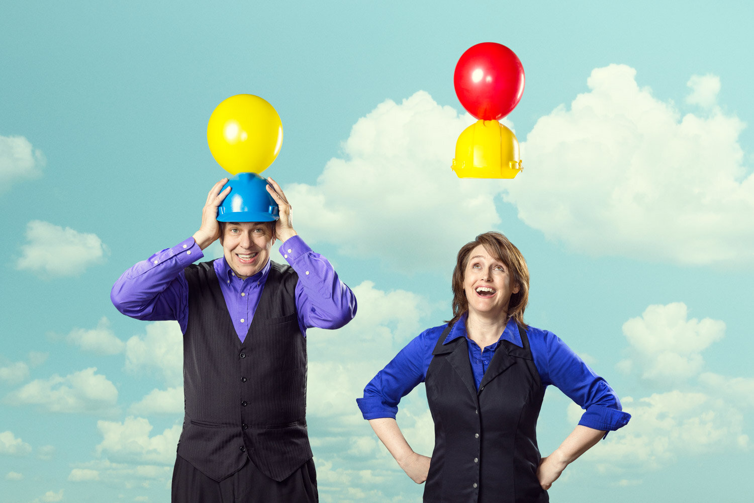 promotional photo of juggler duo with hard hats and floating balloons by portrait photographer Hanna Agar