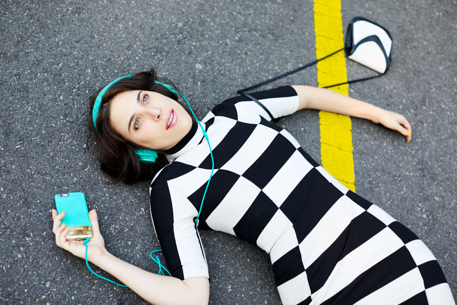musician Janna Pelle lays in road for her Hit and Run album art promotional photo by portrait photographer Hanna Agar 