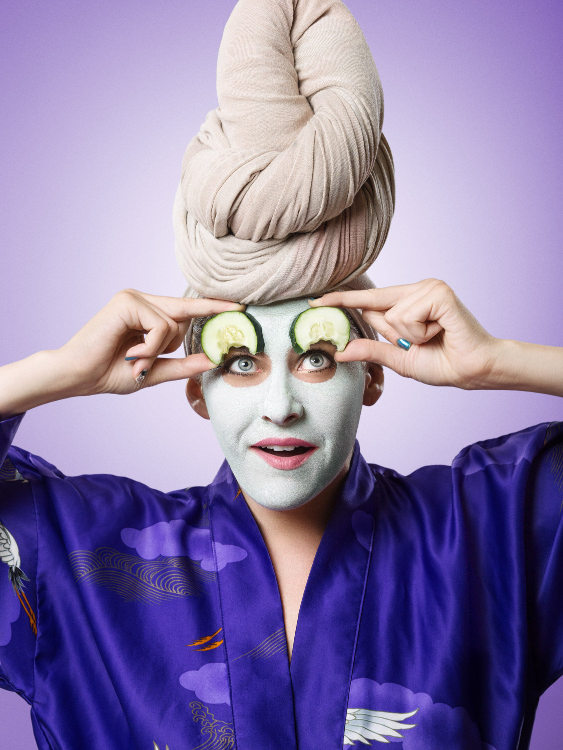 entertainer Michelle Joni eats her spa day cucumbers; creative beauty portrait to promote her business by creative portrait photographer Hanna Agar