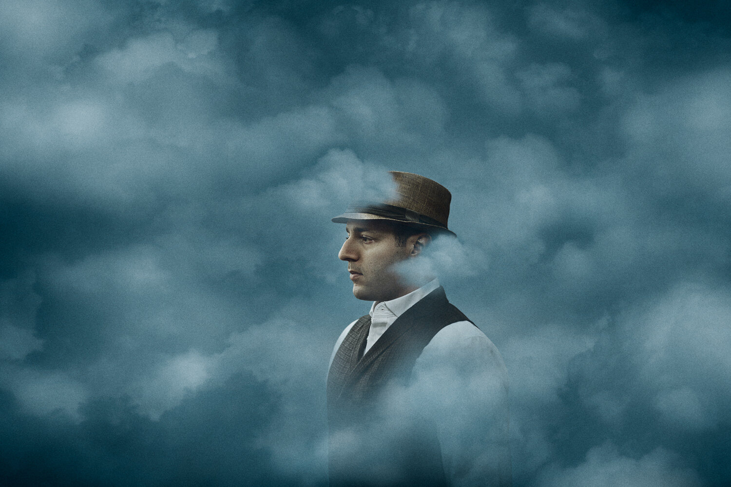 surreal portrait of singer in vintage outfit surrounded by clouds by conceptual portrait photographer Hanna Agar