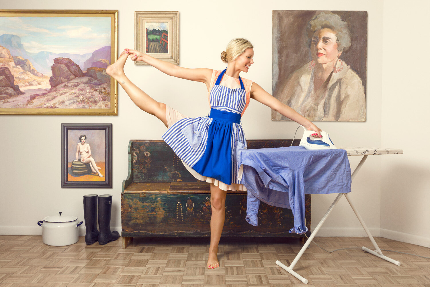 creative portrait of yogi Leila Johnson ironing a shirt while standing in a yoga pose by conceptual portrait photographer Hanna Agar