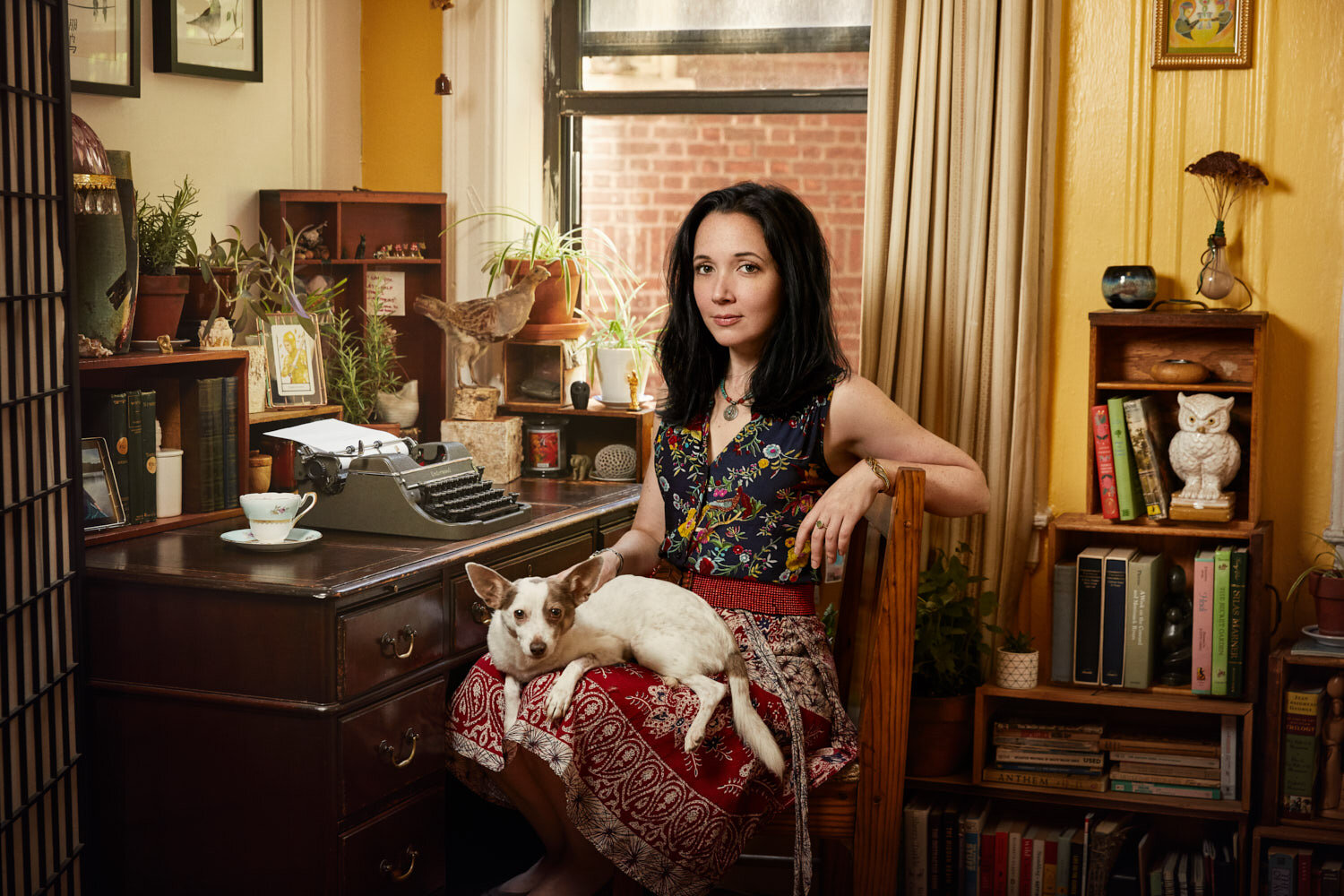 personal branding photo of writer Jacqueline Raposo in her vintage home office with her dog by portrait photographer Hanna Agar