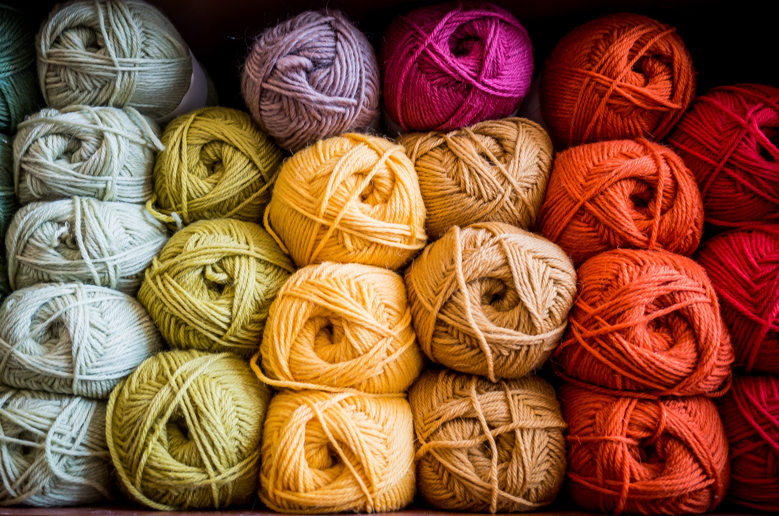 Recently I took some images specifically to be used for a knit and crochet crafter’s business cards. She wanted images that conveyed her creativity, love of bright colors, and knack for creating custom knit items out of raw materials. We ended up deciding together that neatly organized bundles of unbranded yarn of various colors would be our best approach. 