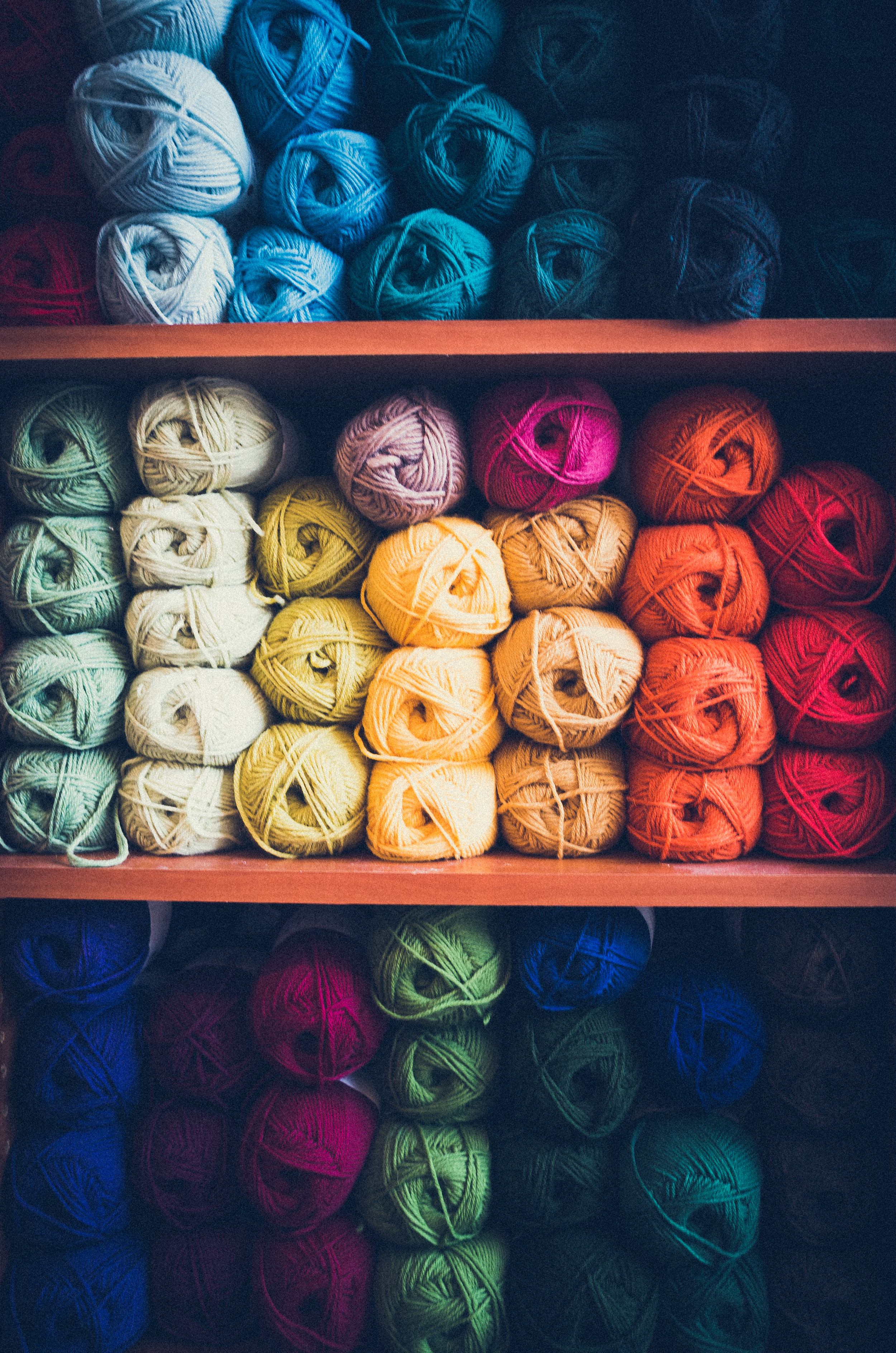 This is the shot she used for her primary business card. The darker yarns on the shelves above and below allow for white text to be overlaid in a visually pleasing way. When shooting for text, A Pro will look for opportunities for negative space like this.