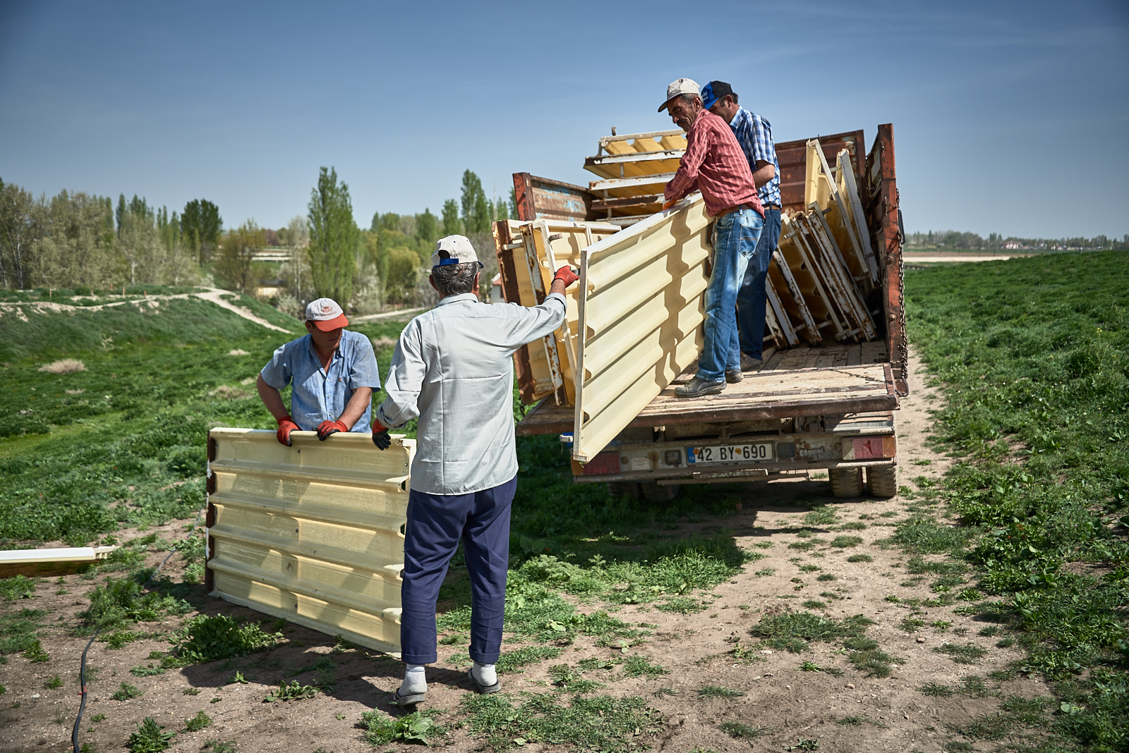  Workers haul away side panels removed from the South Shelter. 