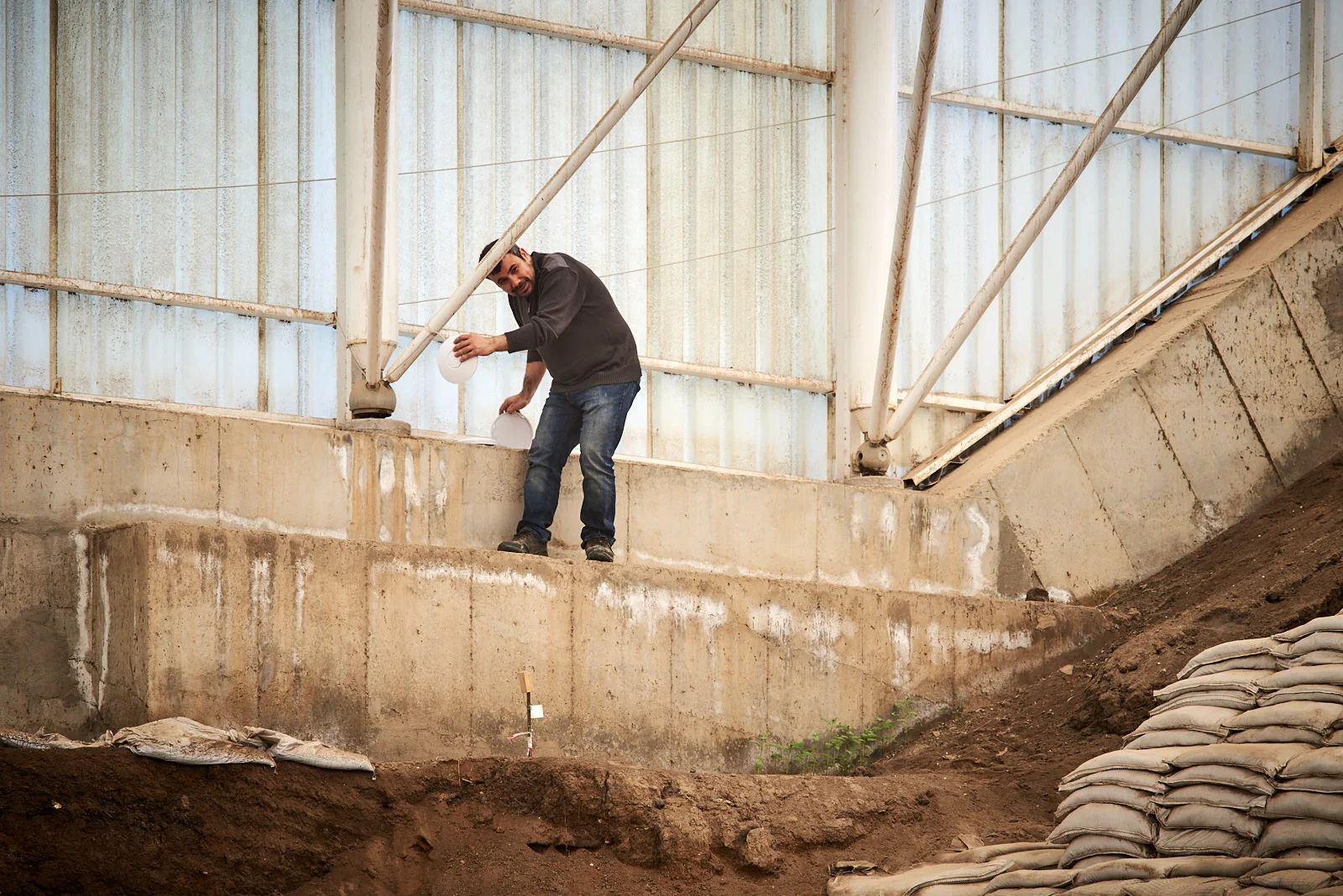 Ahmed installs wifi network in the South Area for connecting to excavation database on site.