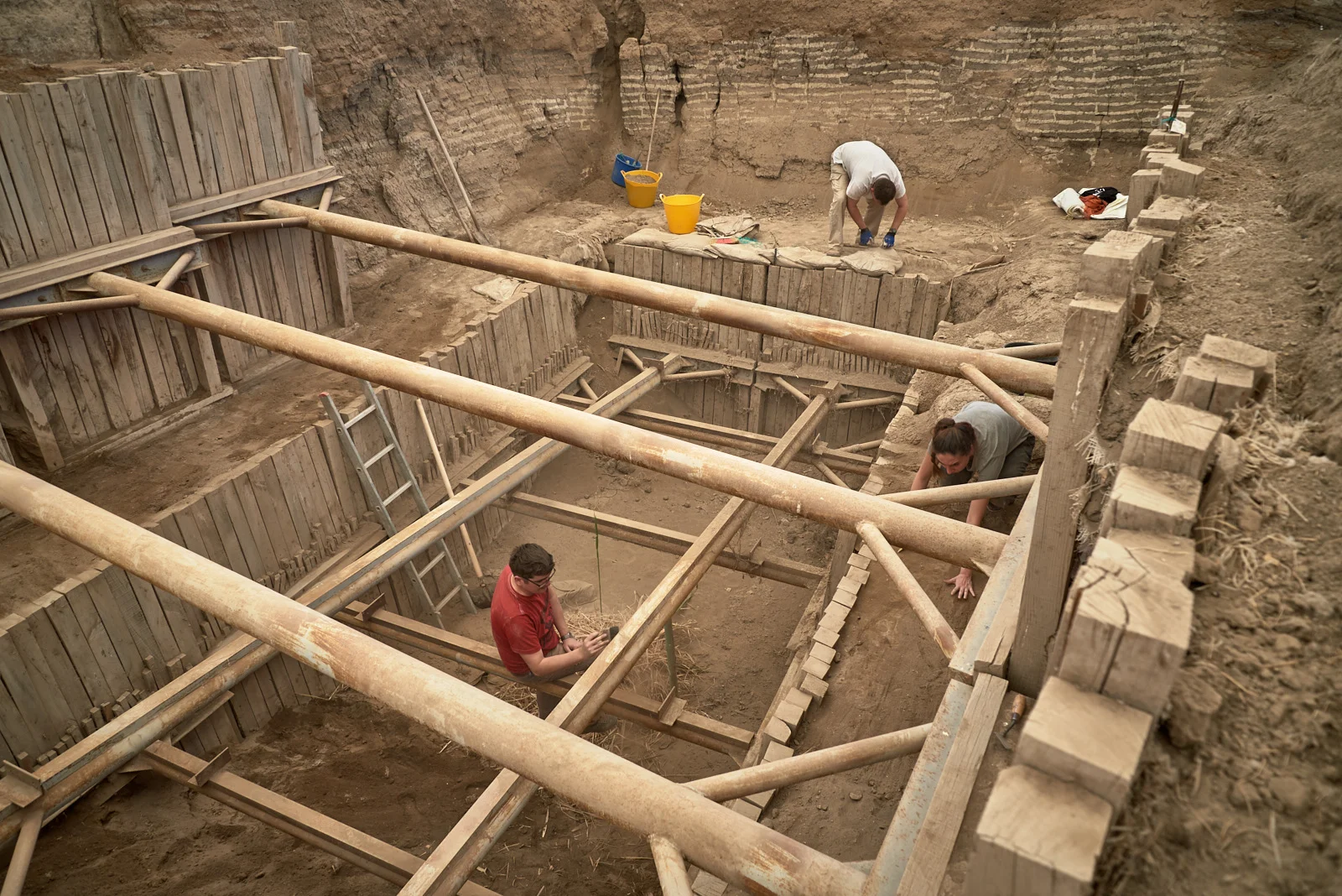 Marek, Arek, and Duygu clean at the bottom of the South excavation area at the beginning of the 2017 season.