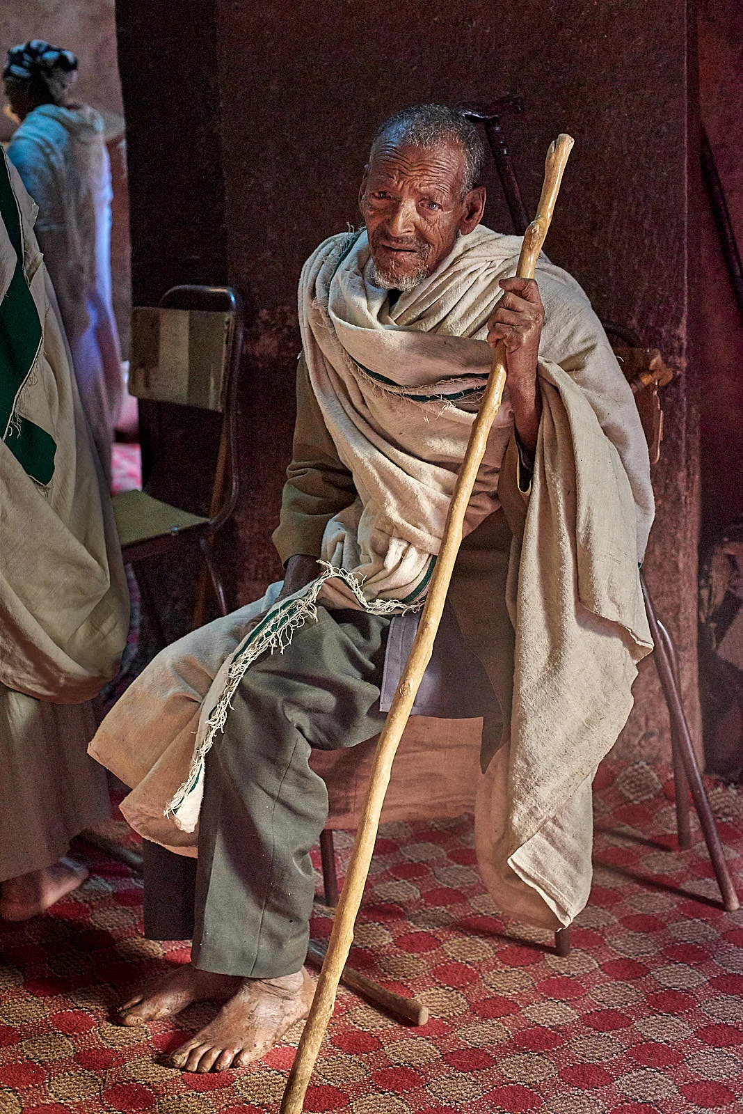 Ethiopian Orthodox pilgrim at rest inside the Church of Saint George, Lalibela, Ethiopia.