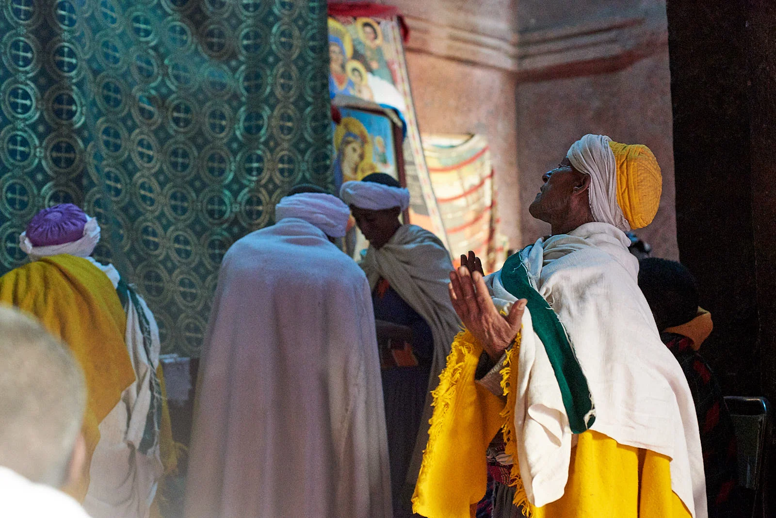 Ethiopian Orthodox pilgrims worshiping inside the Church of Saint George, Lalibela, Ethiopia.