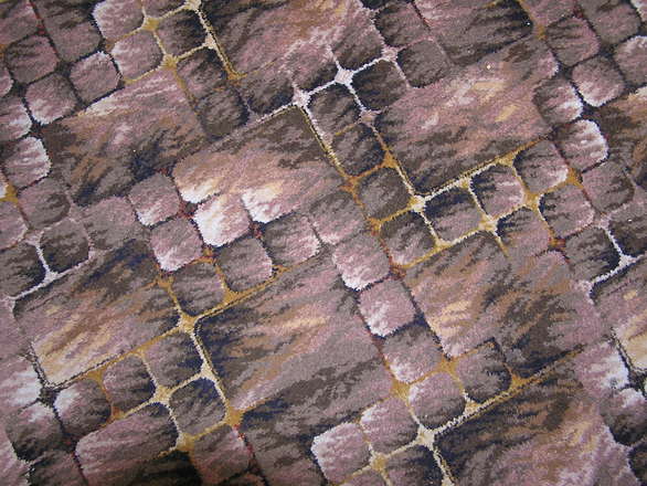 It might sound like something straight out of 2001: A Space Odyssey, but one of the newest and greatest trends in carpeting is modular carpeting. Forget everything you once knew about how carpeting works and can be installed, as modular carpeting makes it a thing of the past. With regular carpeting, you roll out the fabric – and you usually only get one style and color per room – and that’s all there is to it. With modular carpeting, the possibilities are endless. We at Ozburn-Hessey are future-thinkers, people who see the future happening while it’s still potential in the eyes of most people. With that in mind, here are some reason you should think about switching to modular carpeting. The Power is in Your Hands Again The main reason modular carpeting is as popular as it is these days is because of the design power it gives you. The way it works is each piece is a small square, essentially making it into a larger fabric tile. You can alternate pieces if you want to, or have half a room dark and the other half white. Or maybe you want to have a rug design in the middle of the room. The point is, you get to make these decisions because each piece is designed to be seamlessly integrated into the next, regardless of whether it’s the same style or material. This modular design also makes it a great idea for businesses and schools, as transporting the carpet, which was once an arduous chore involving many, many heavy rolls and lots of manpower, has transformed into something easy, akin to transporting the dozens of boxes that are already going to these places. Additionally, the install is a lot easier, although it is something we here at Ozburn-Hessey are always willing to help with. Clean up also becomes less of a hassle, because if you seriously stain an area, instead of replacing the whole carpet, you can just replace the offending tiles. Better for the Environment As if that were not enough, modular carpeting is actually better for the environment in several ways. For one, its design and implementation make it a lot easier for manufacturers to use more eco-friendly products, such as reclaimed materials, or in many cases, just recycled modular carpeting. It’s one of the easiest ways for a company to lower its carbon footprint, which is all nice and good, but one of the other things modular carpeting offers is actually more beneficial for consumers, at least in the short term. Pretty much all types of carpeting these days include a number of mildly harmful chemicals, which when breathed in can cause respiratory problems in some people. This irritant is lessened by modular carpeting, because the smaller sizes give the carpet a chance to “breathe” a little more, allowing the chemicals to air out. While it can be a little bit scary to do what you’re not used to, that should not extend to your flooring options. If you have any questions about what modular carpeting can do for you and your flooring needs, give us a call and we will do our best to make sure you’re fully prepared before making that next step.