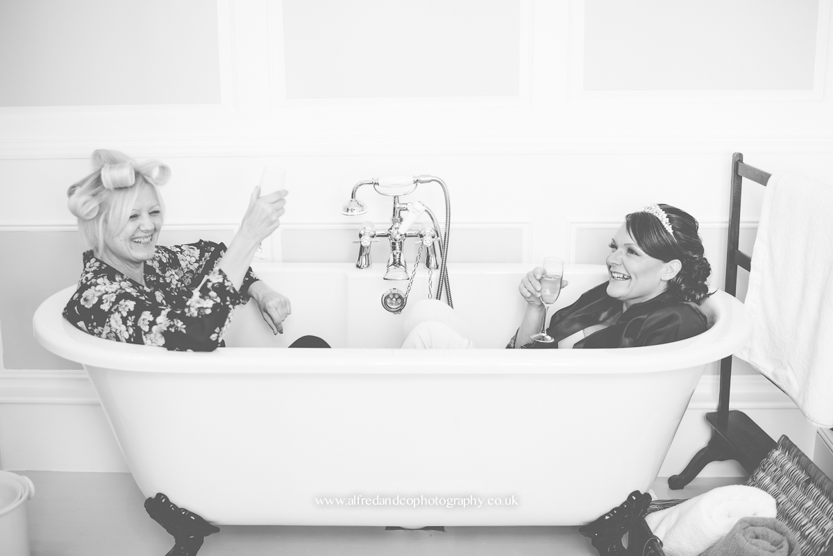 bride and bridesmaid having fun