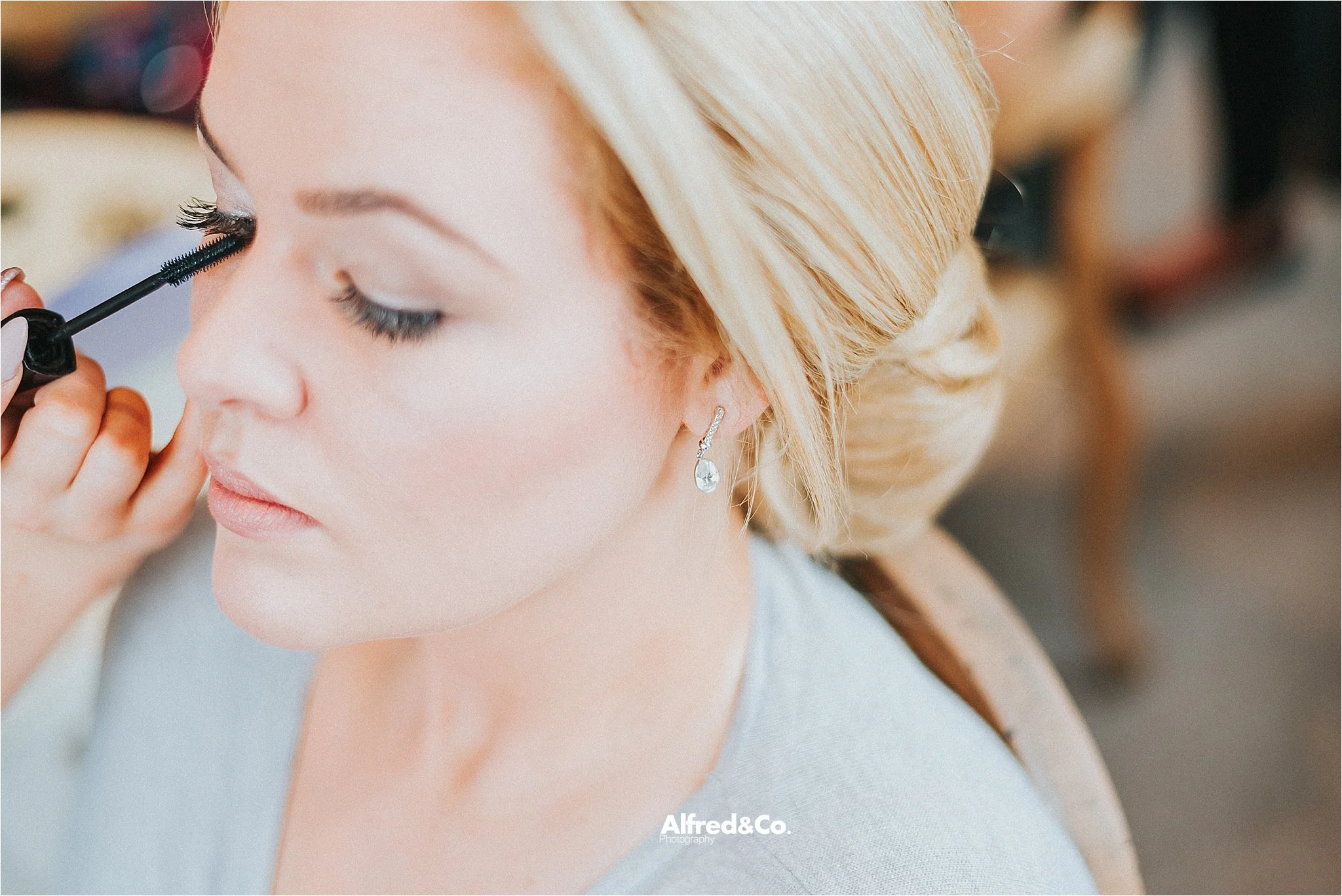 bride getting ready for wedding at eaves hall in clitheroe