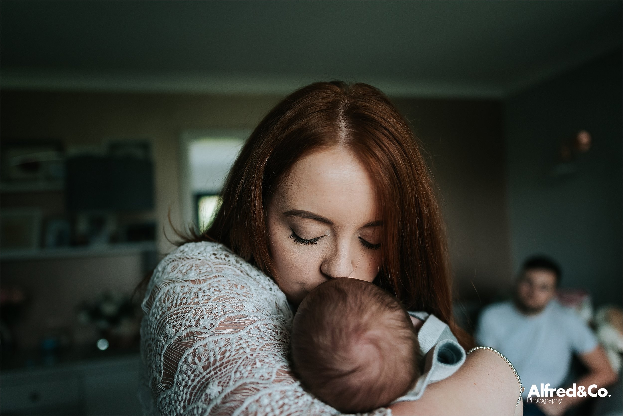 mum kissing baby