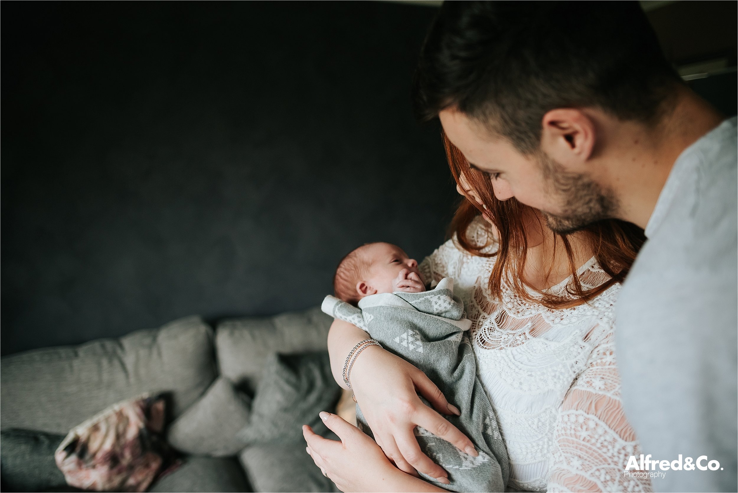 New born with his mum and dad