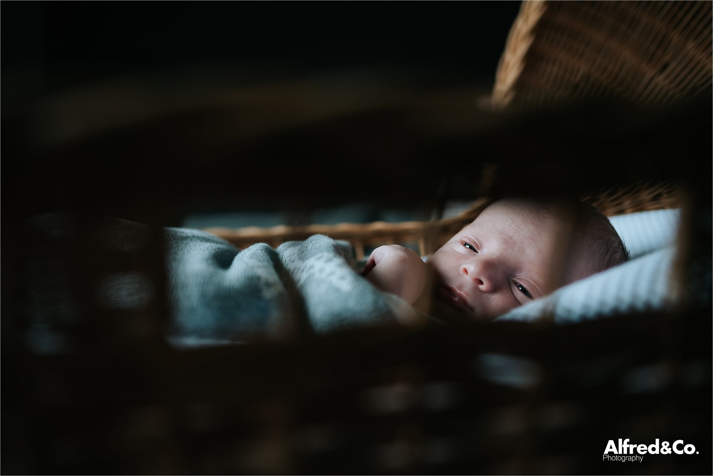 new born baby boy in crib