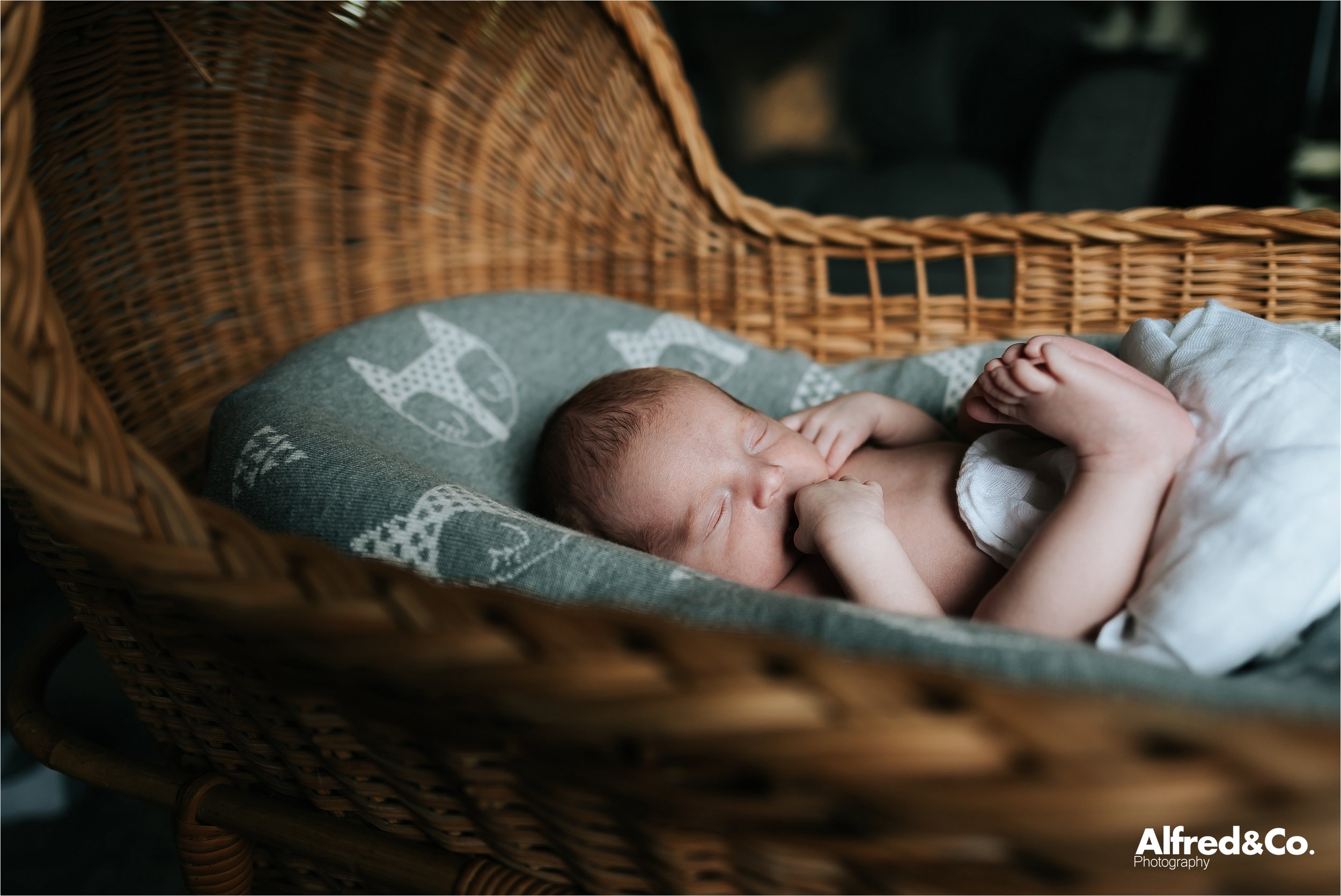 Baby in wicker crib