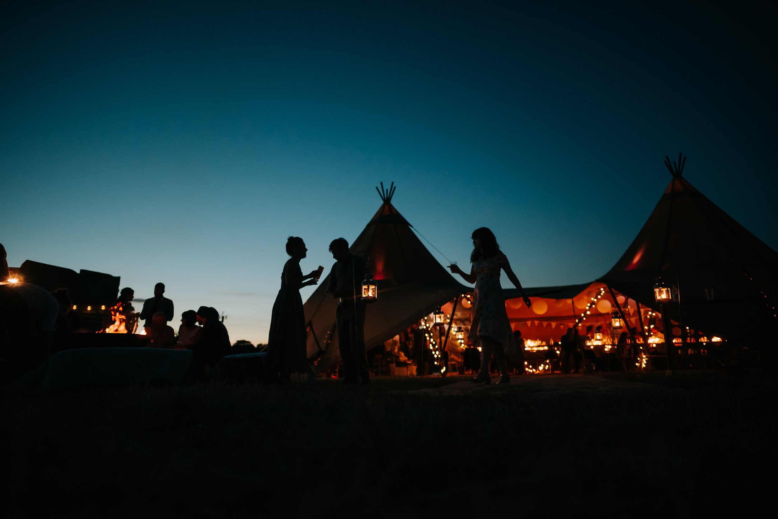 people dancing at a wedding outside 