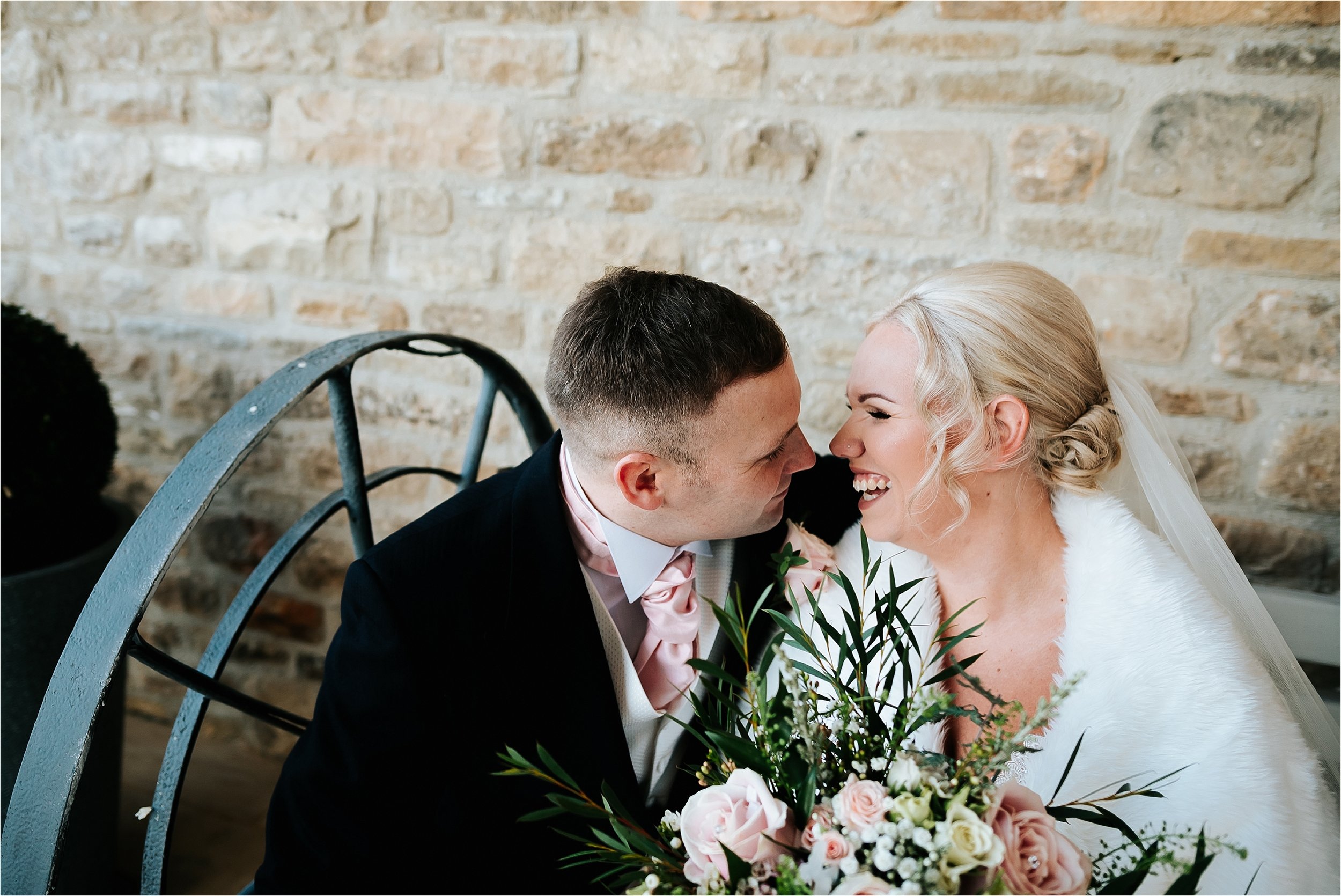 bride and groom laugh 