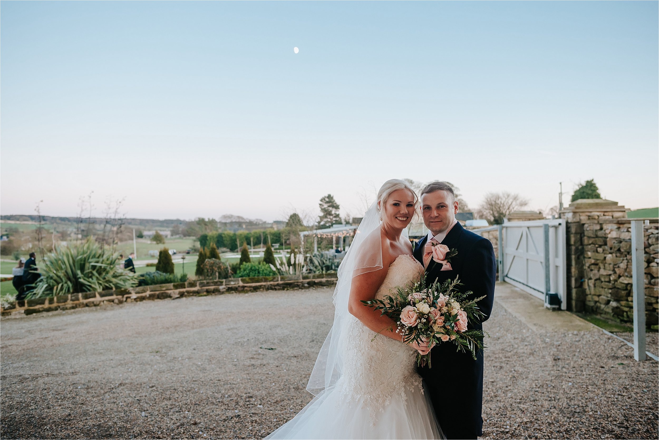 bride and groom as sun sets 