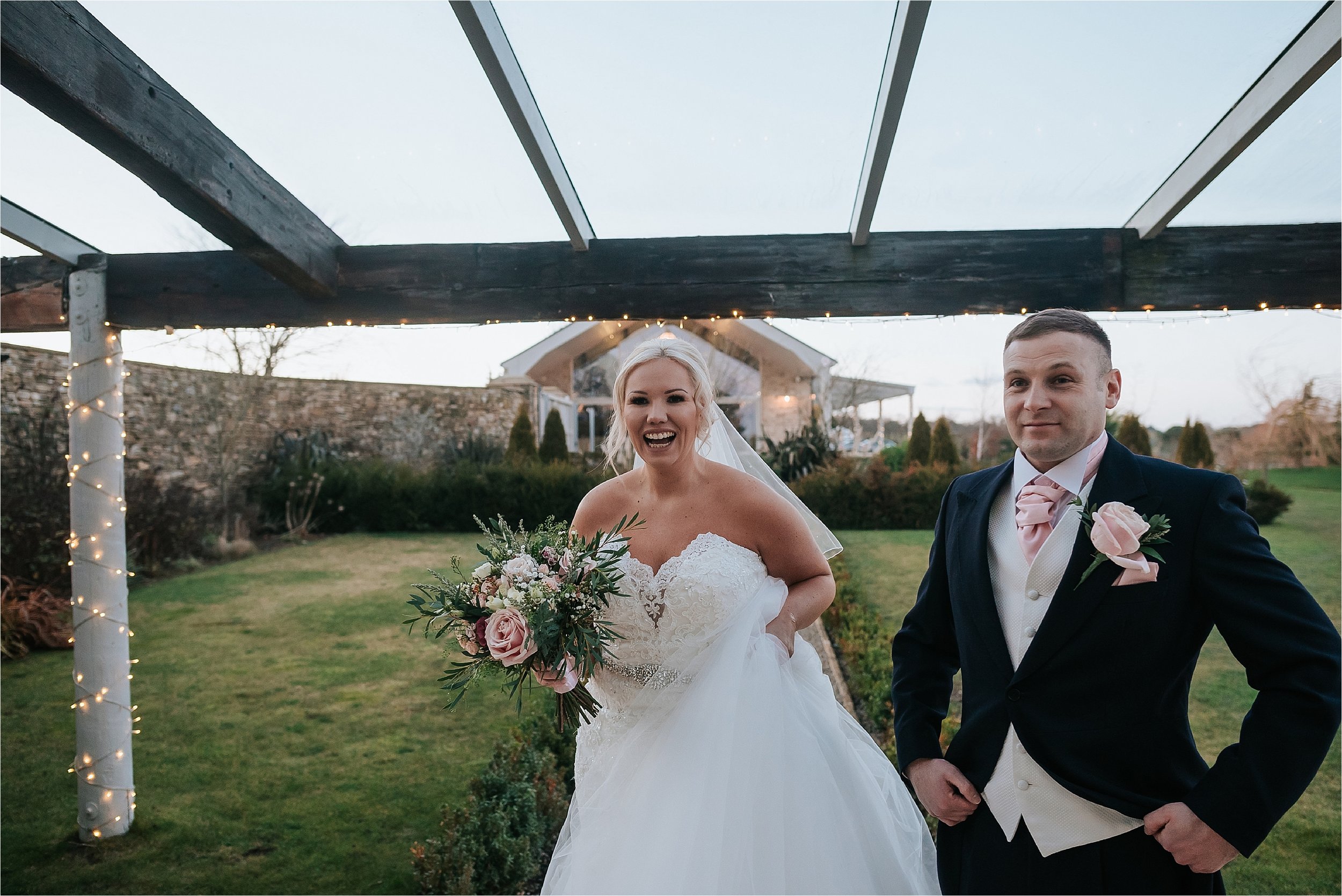 bride and groom outside yorkshire wedding barn 