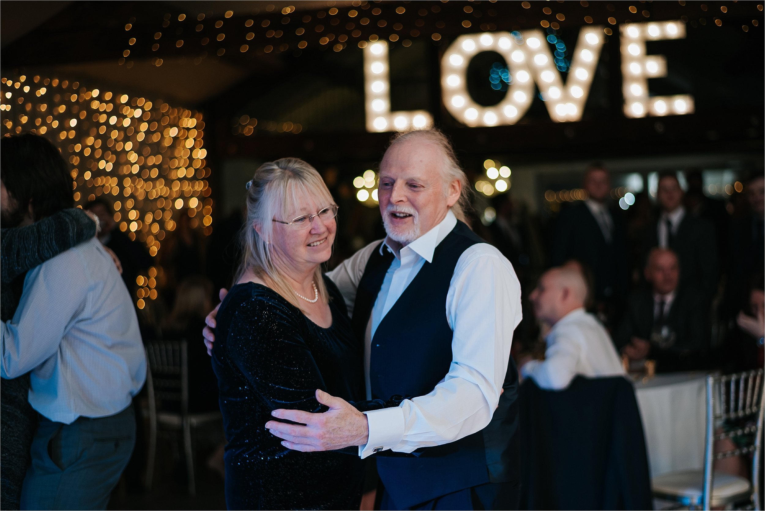 older couple dancing at wedding 