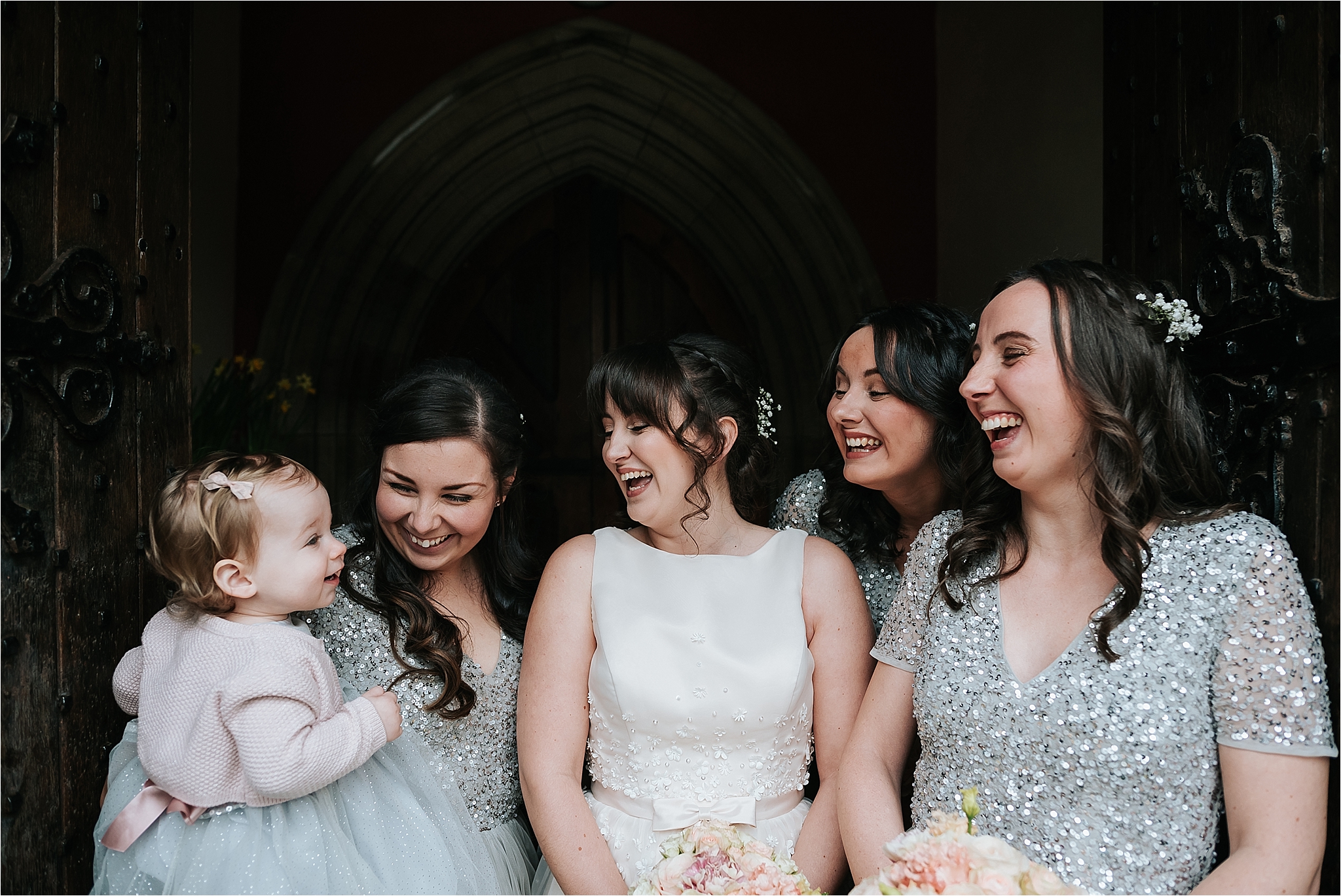 bridesmaids and bride outside church