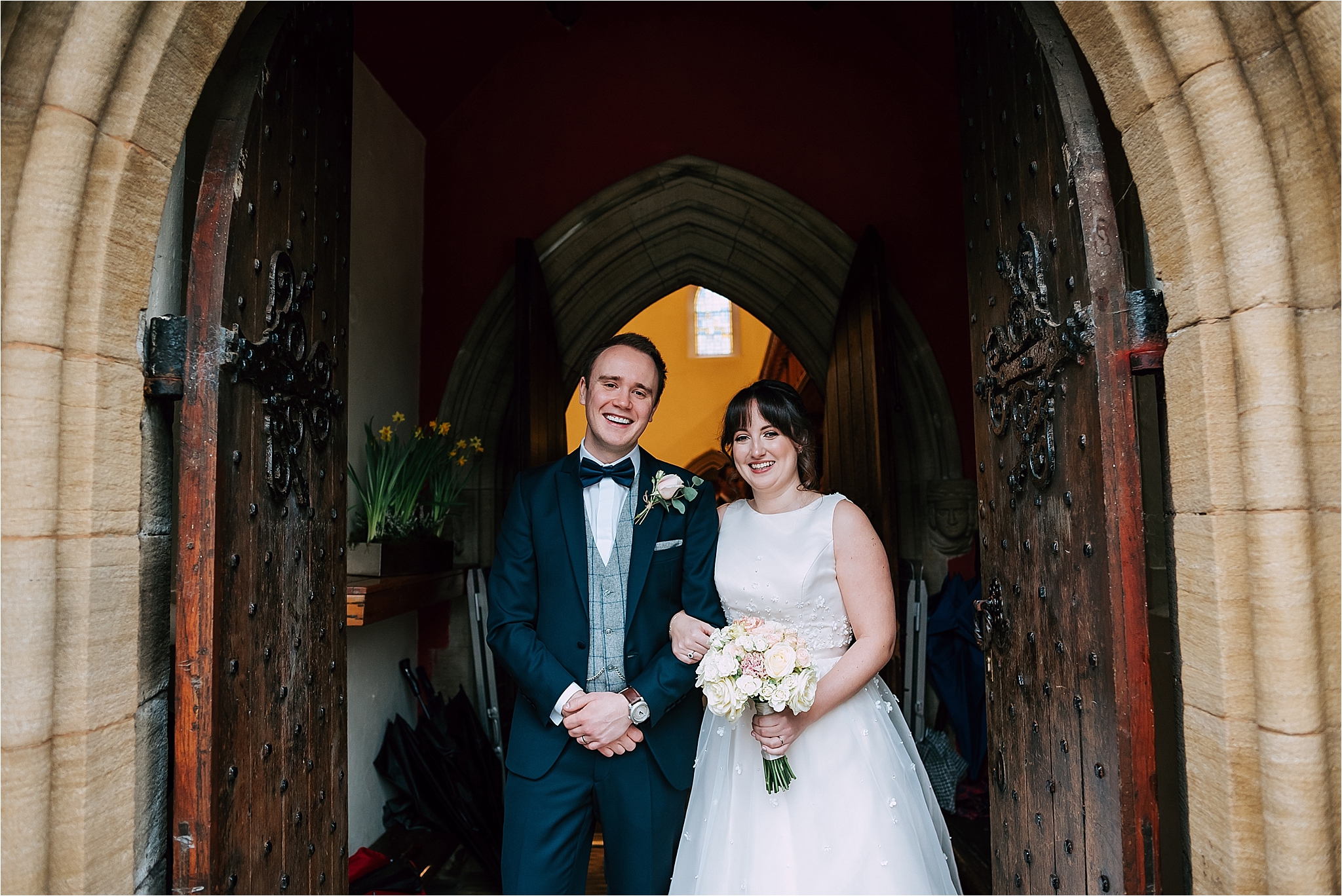 bride and groom outside church in bolton