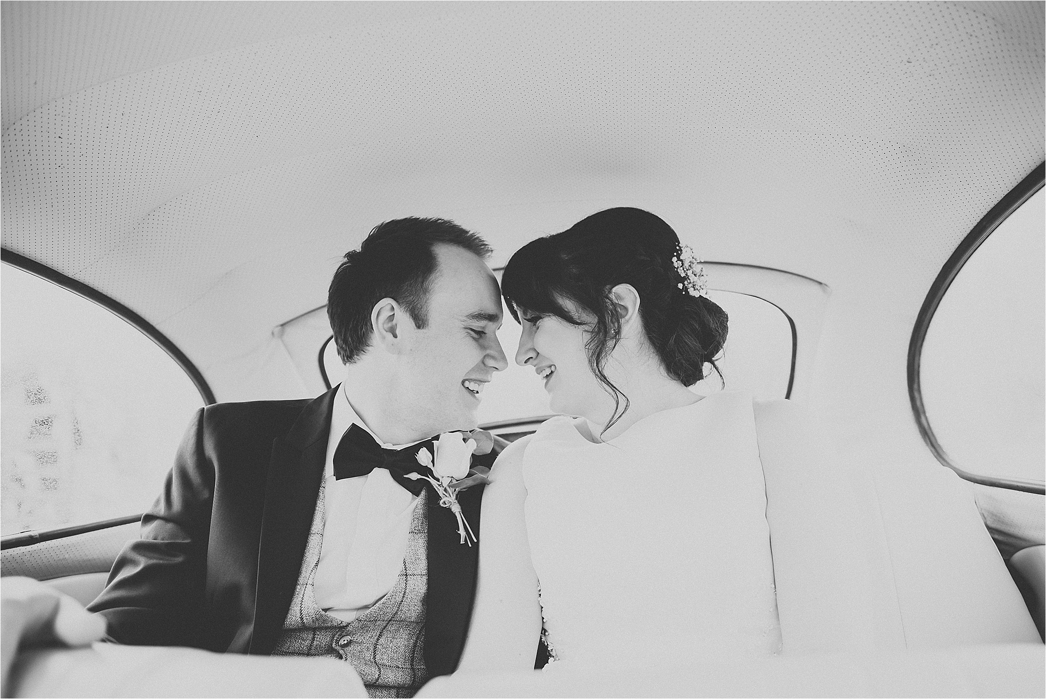 bride and groom inside vintage wedding beetle