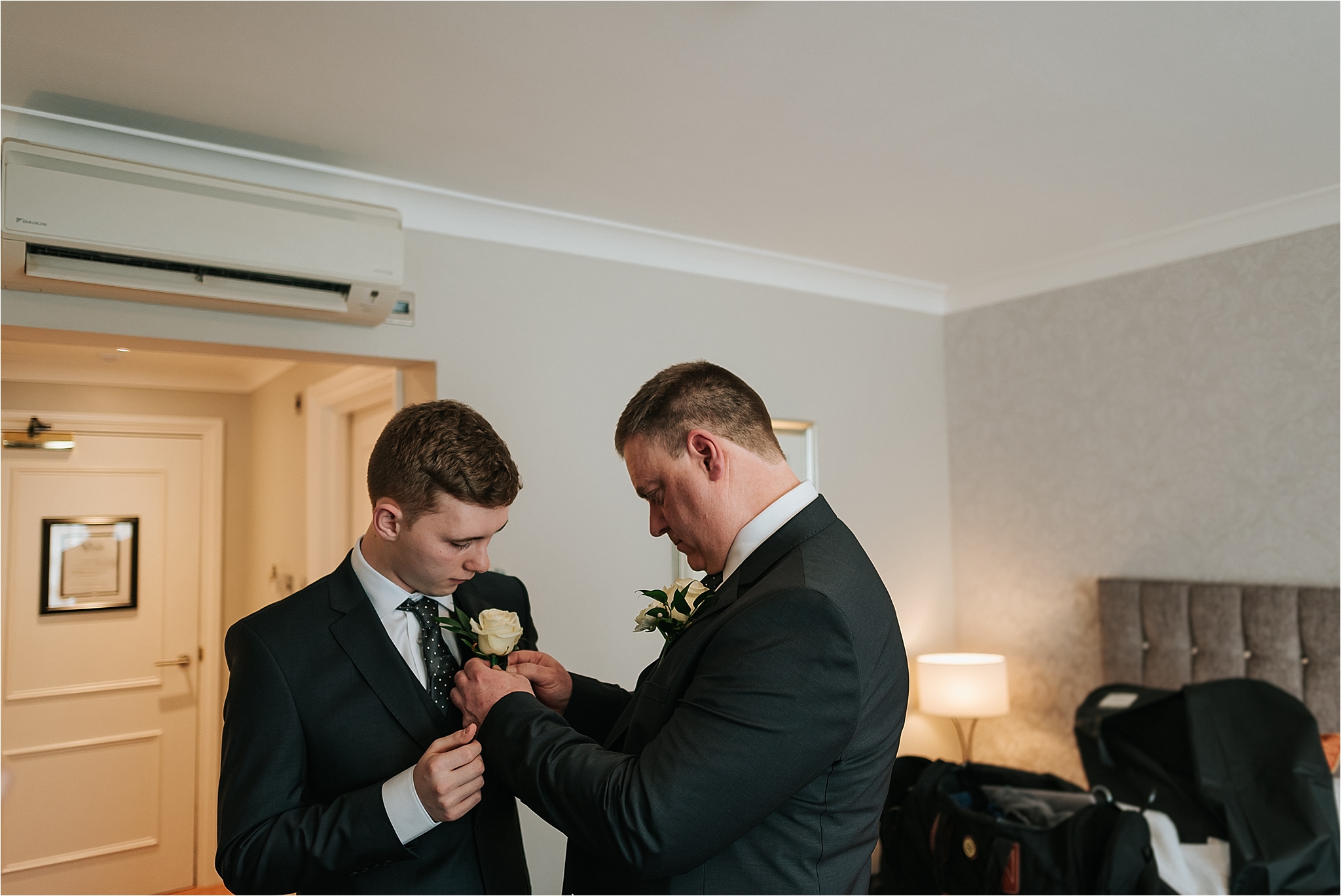 father and son get ready for wedding 