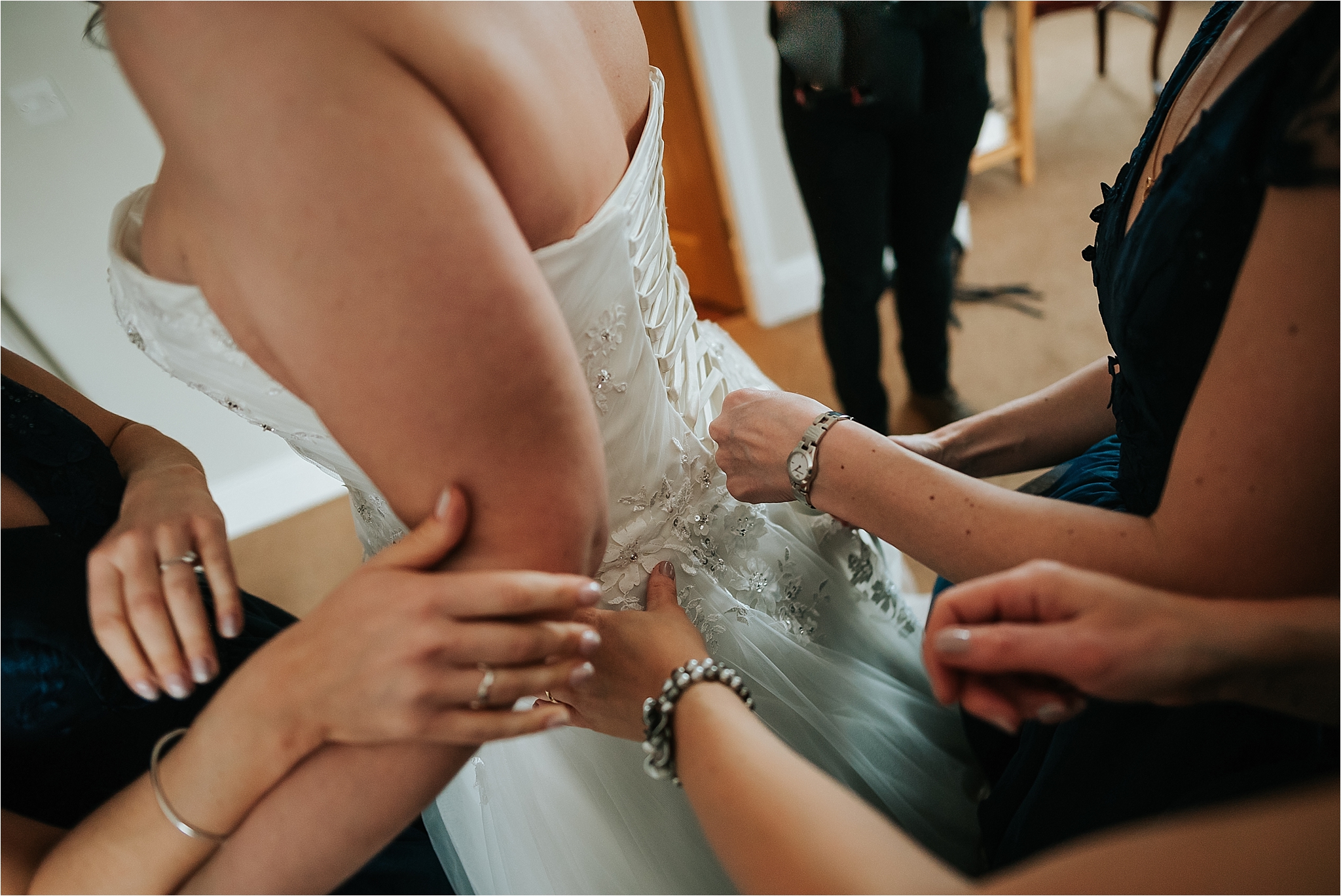 bridesmaids getting the bride ready 