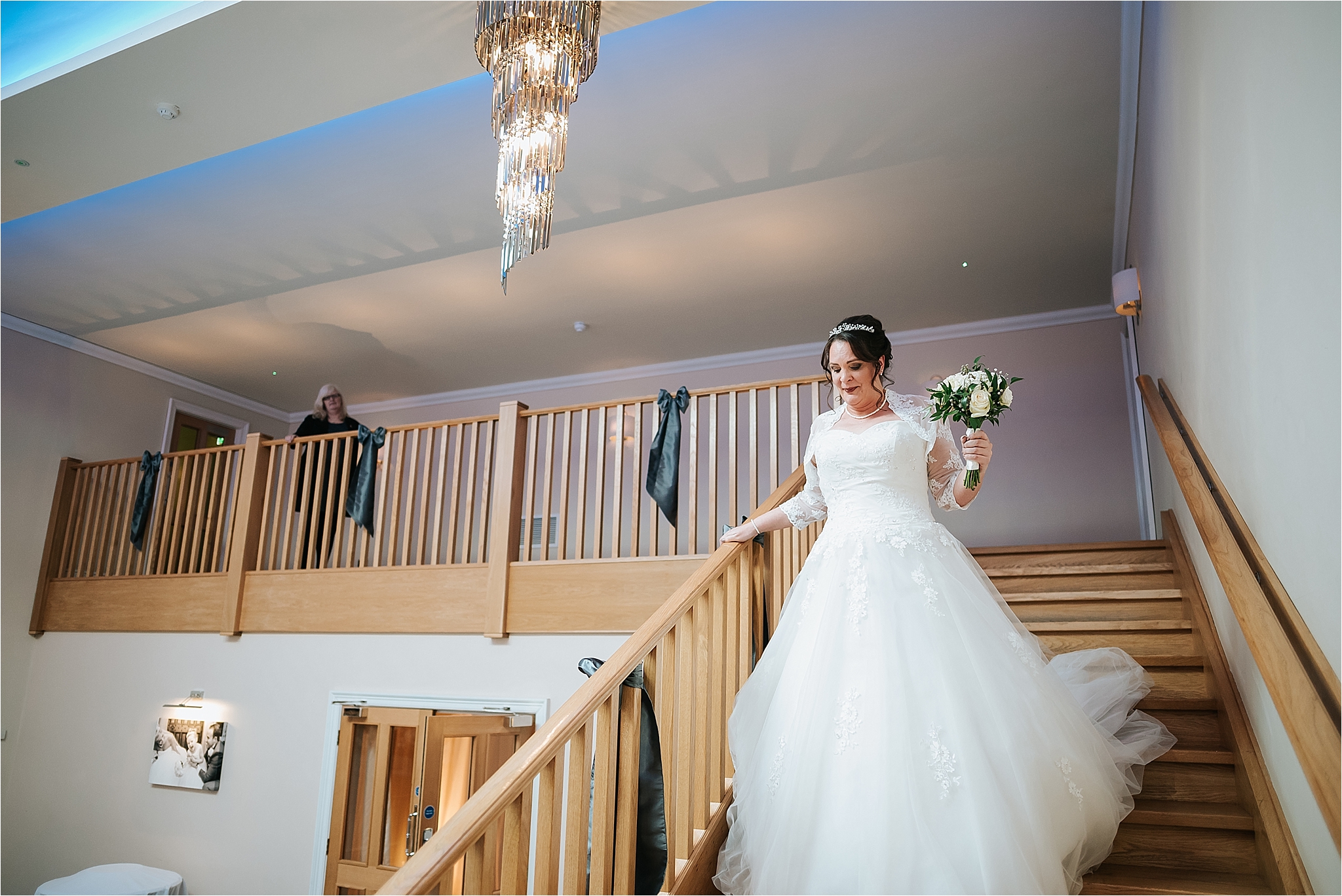bride walks down steps at the villa 