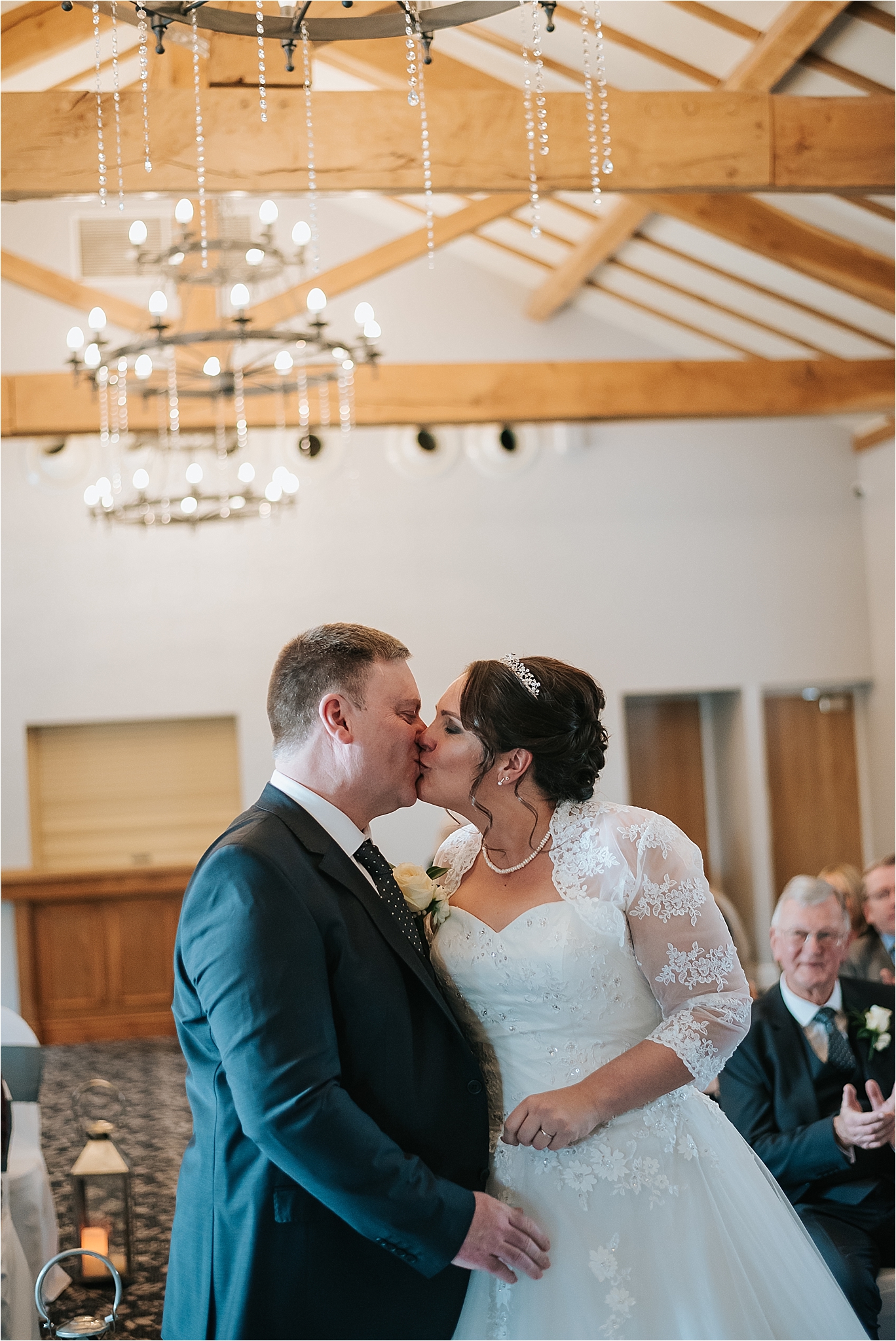 couple kissing at wedding at the villa wrea green 