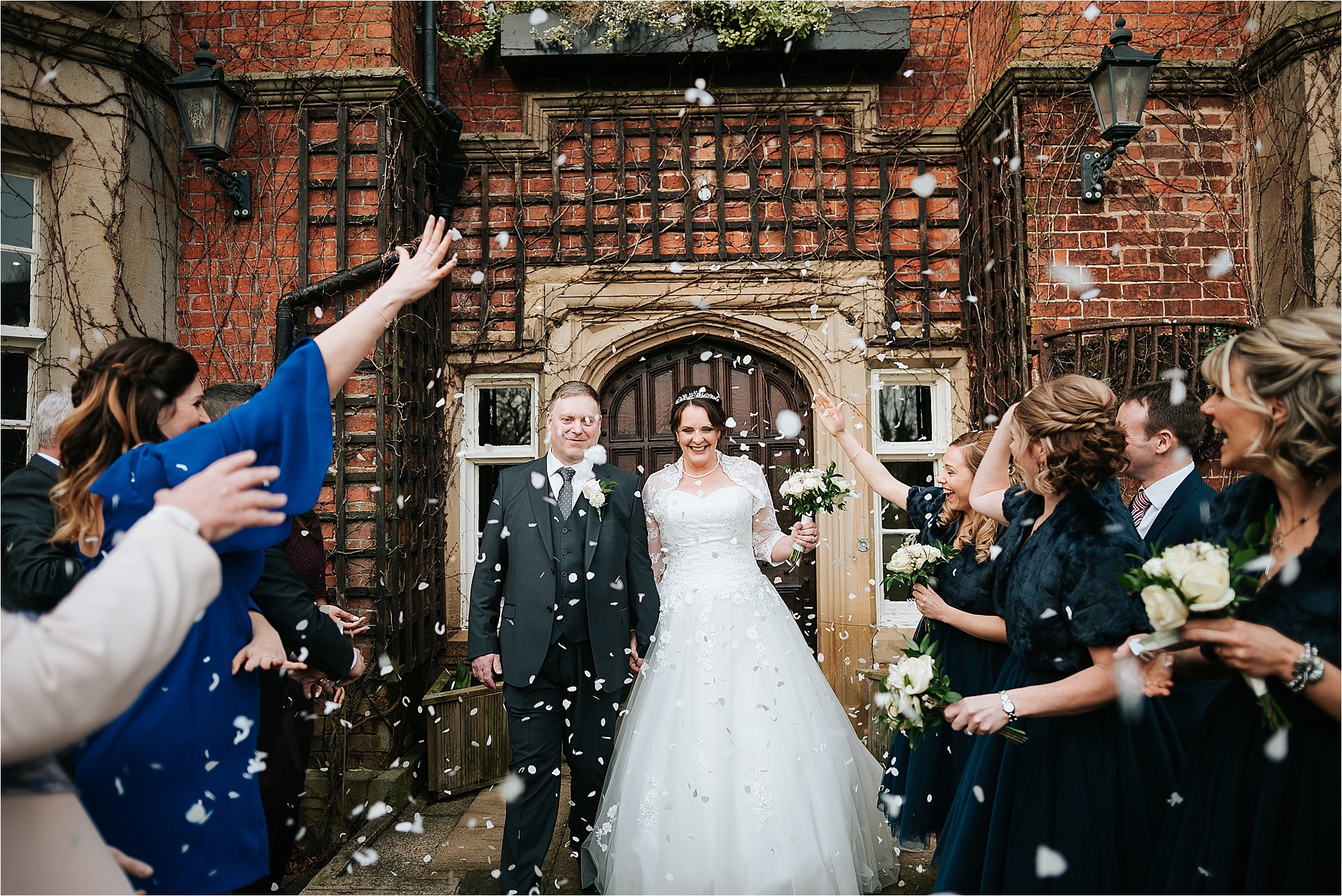 couple walking through confetti at the villa wrea green