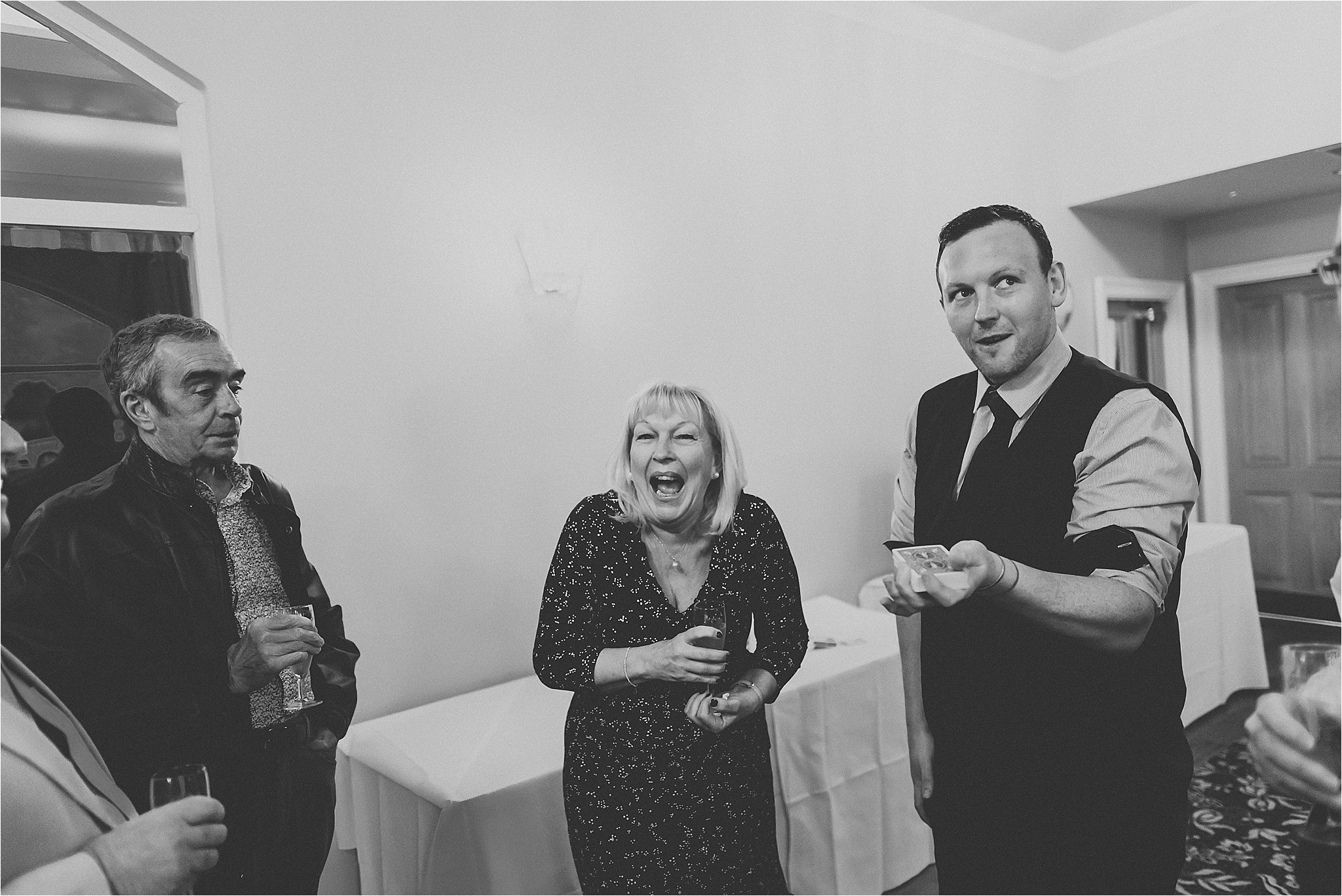 magician entertains wedding guests 