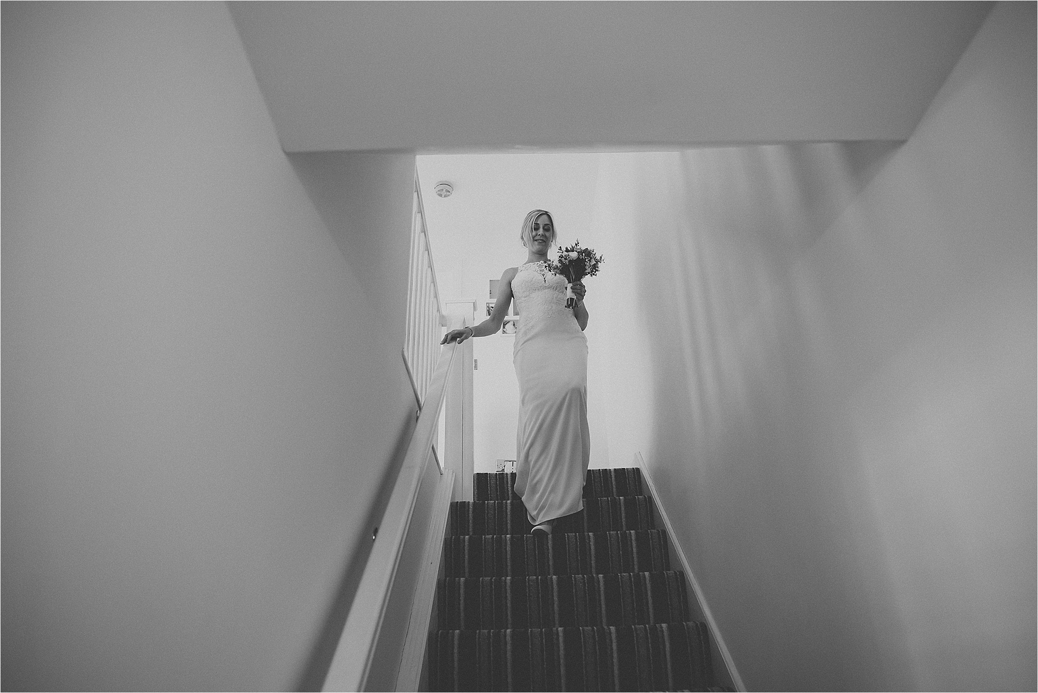 bride walks down the steps before wedding