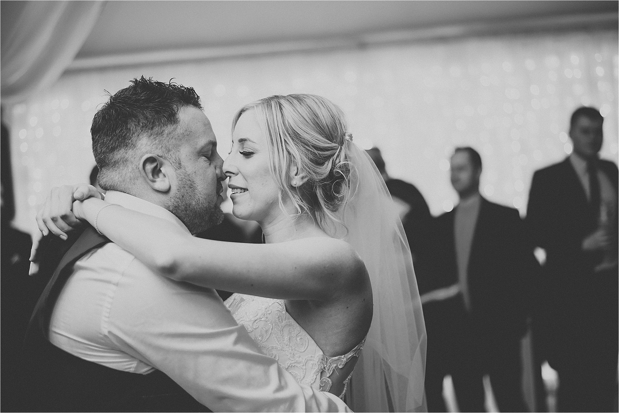 bride and groom enjoying their first dance at wedding