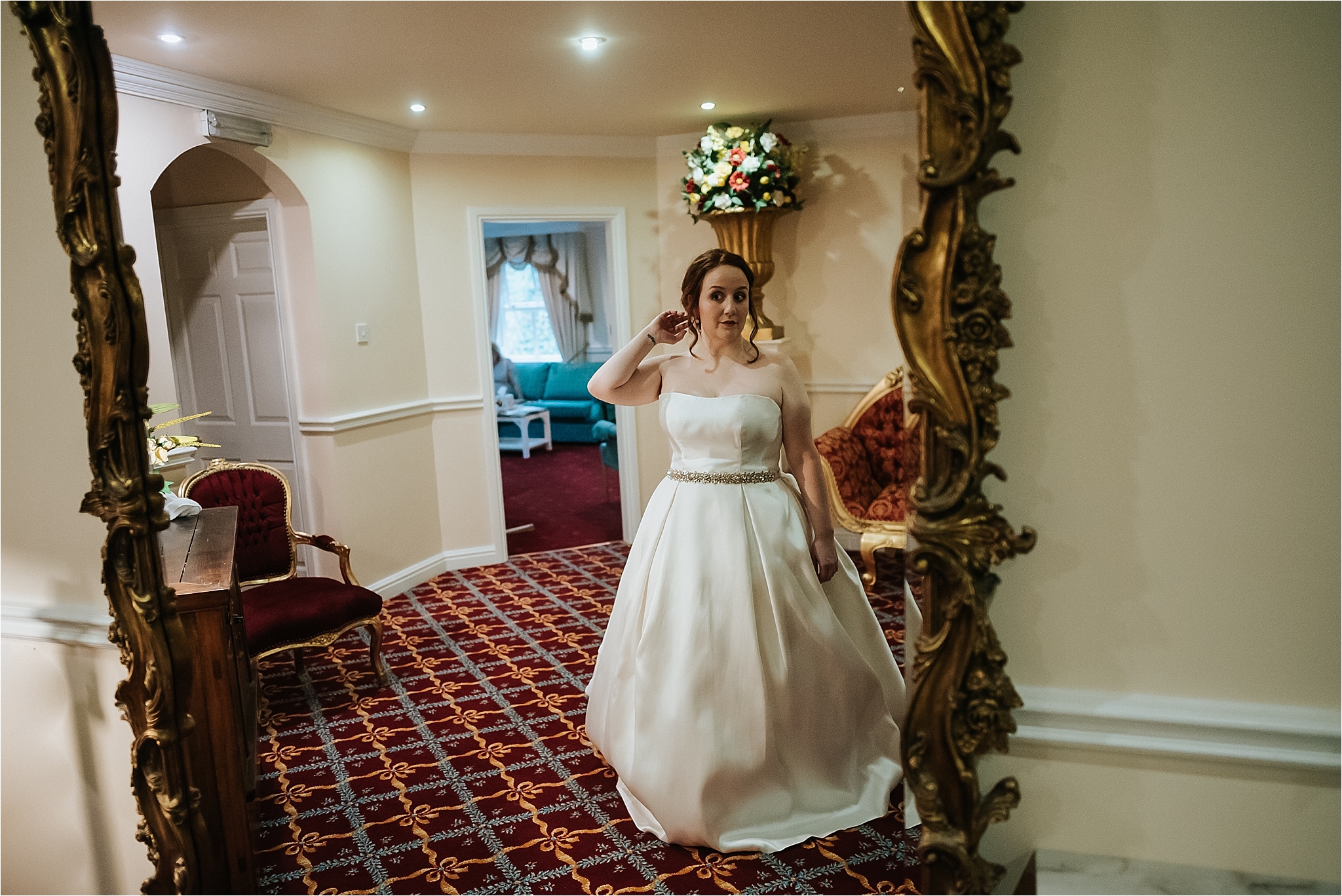 bride looks in mirror