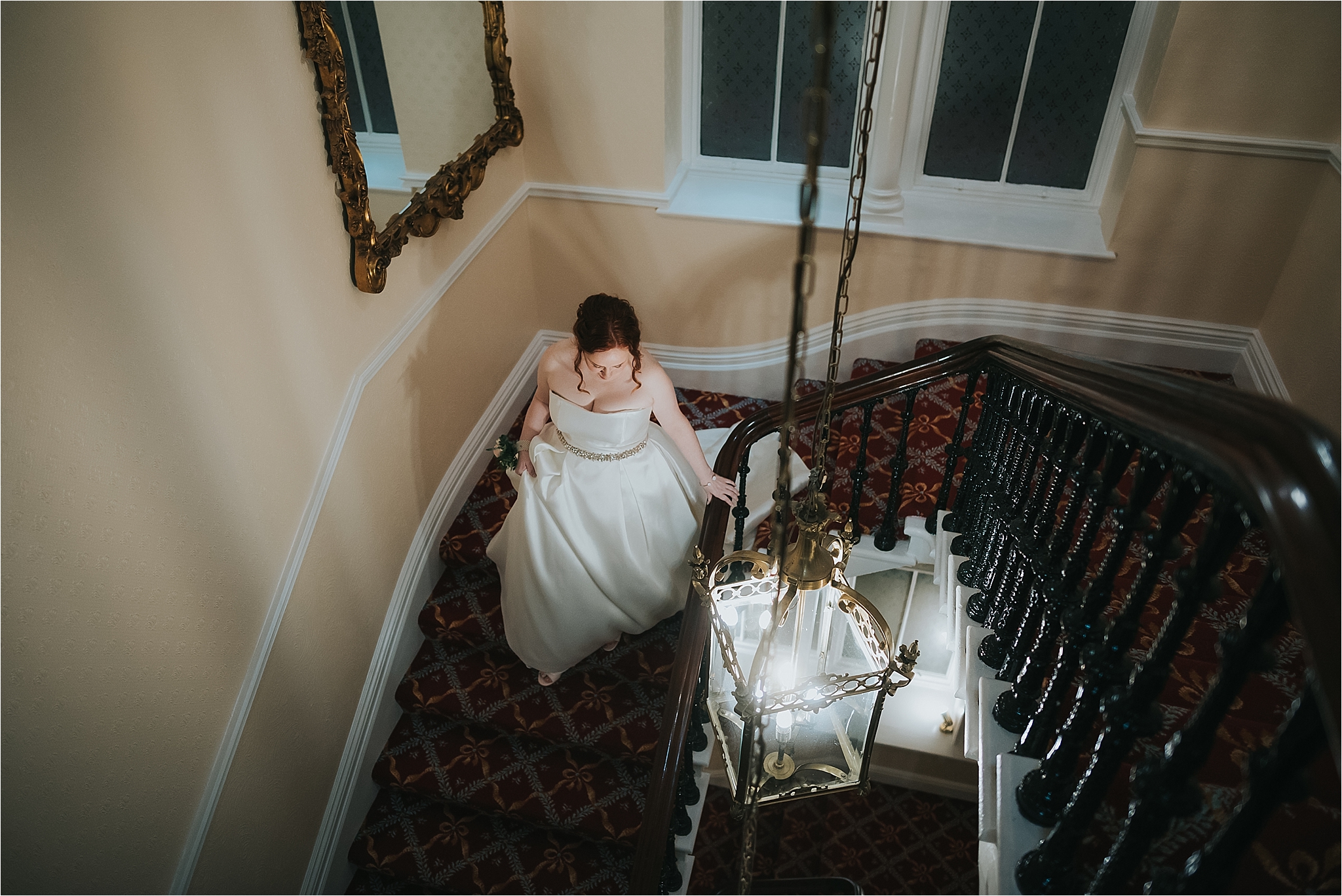 bride walks down the stairs at the grange hotel