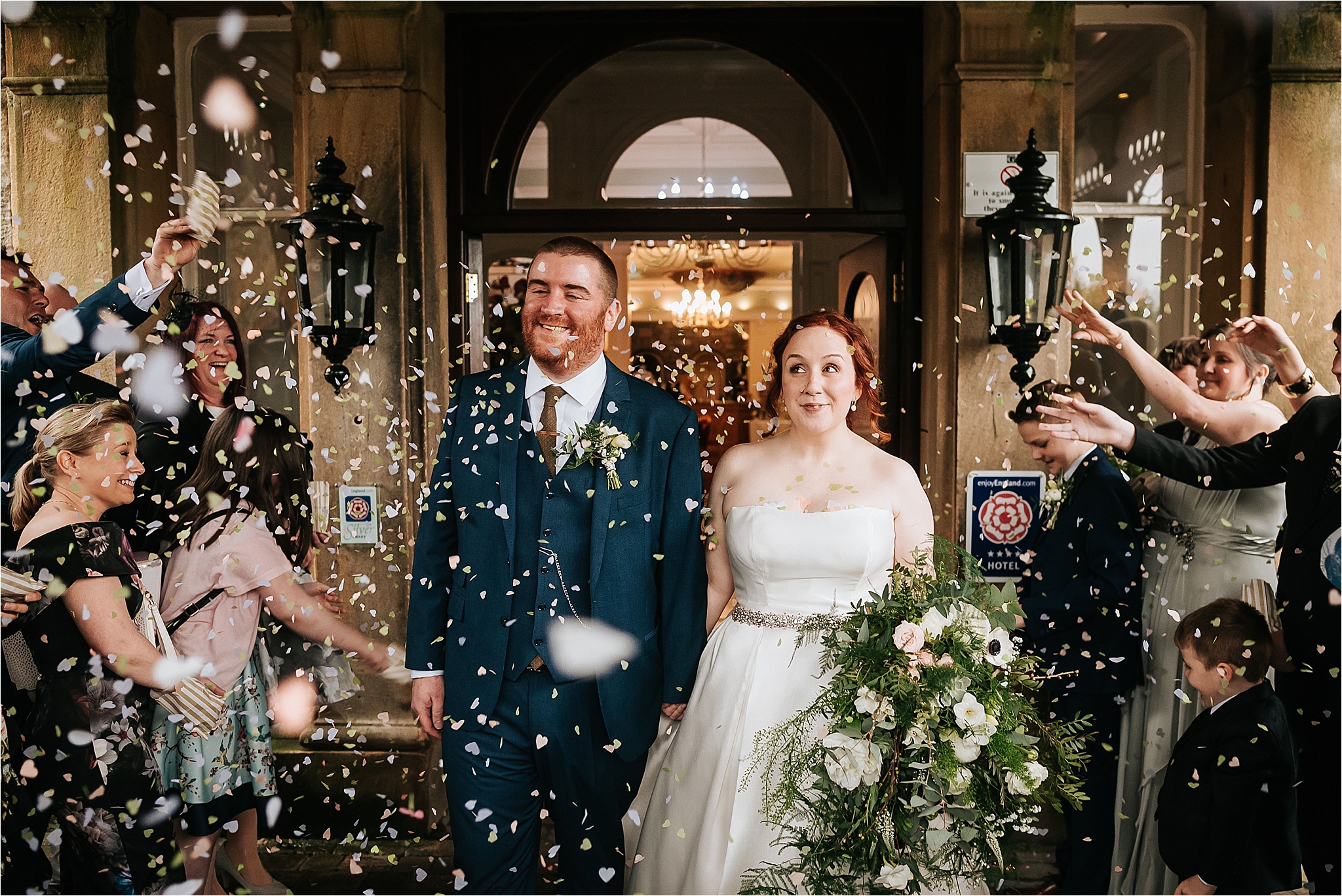 bride and groom getting showered in confetti