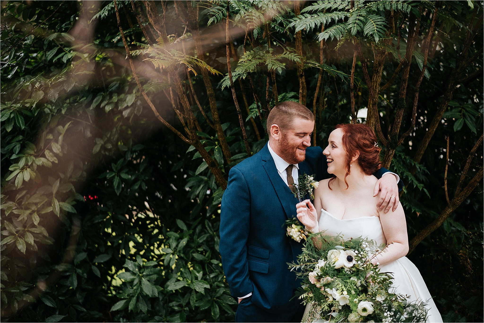 bride and groom pose for photographs 