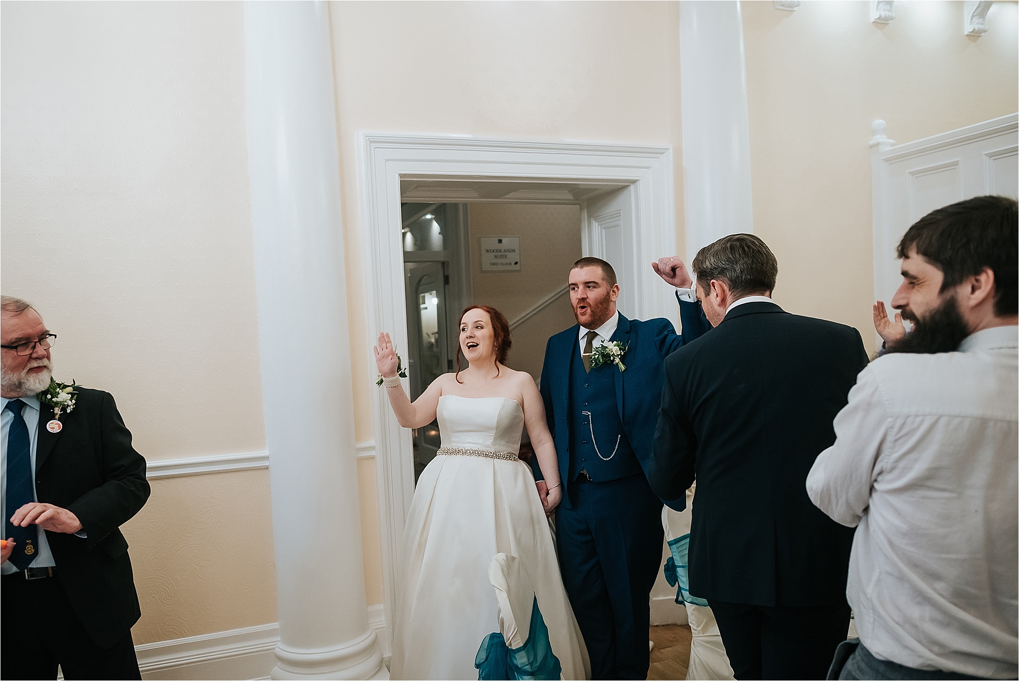 bride and groom enter the room 