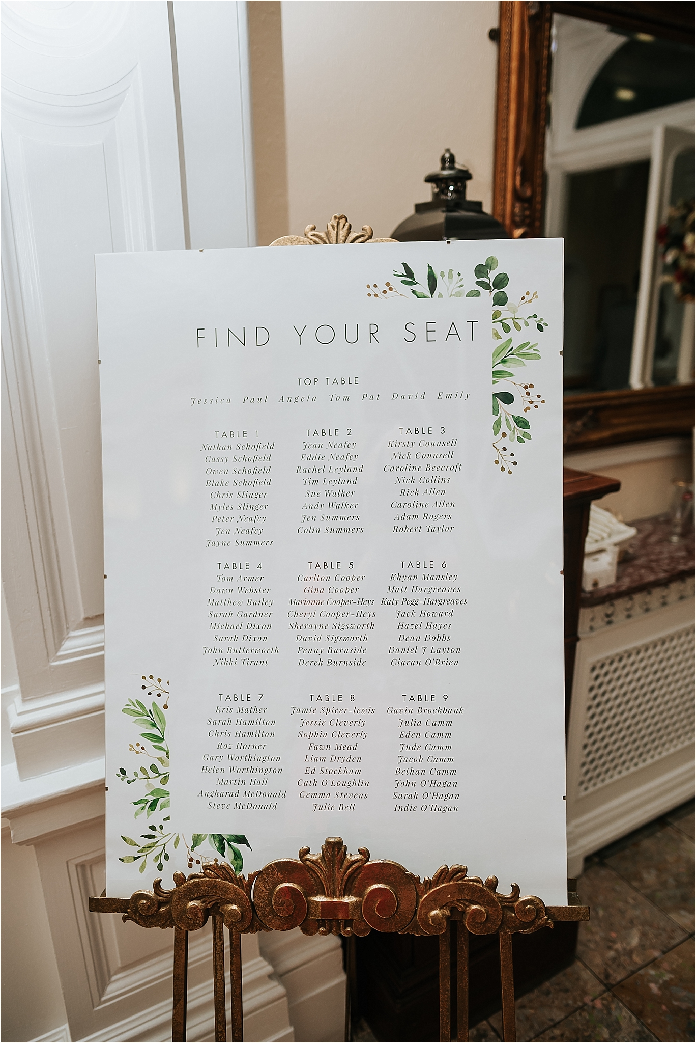 table plan at spring wedding with green foliage design 