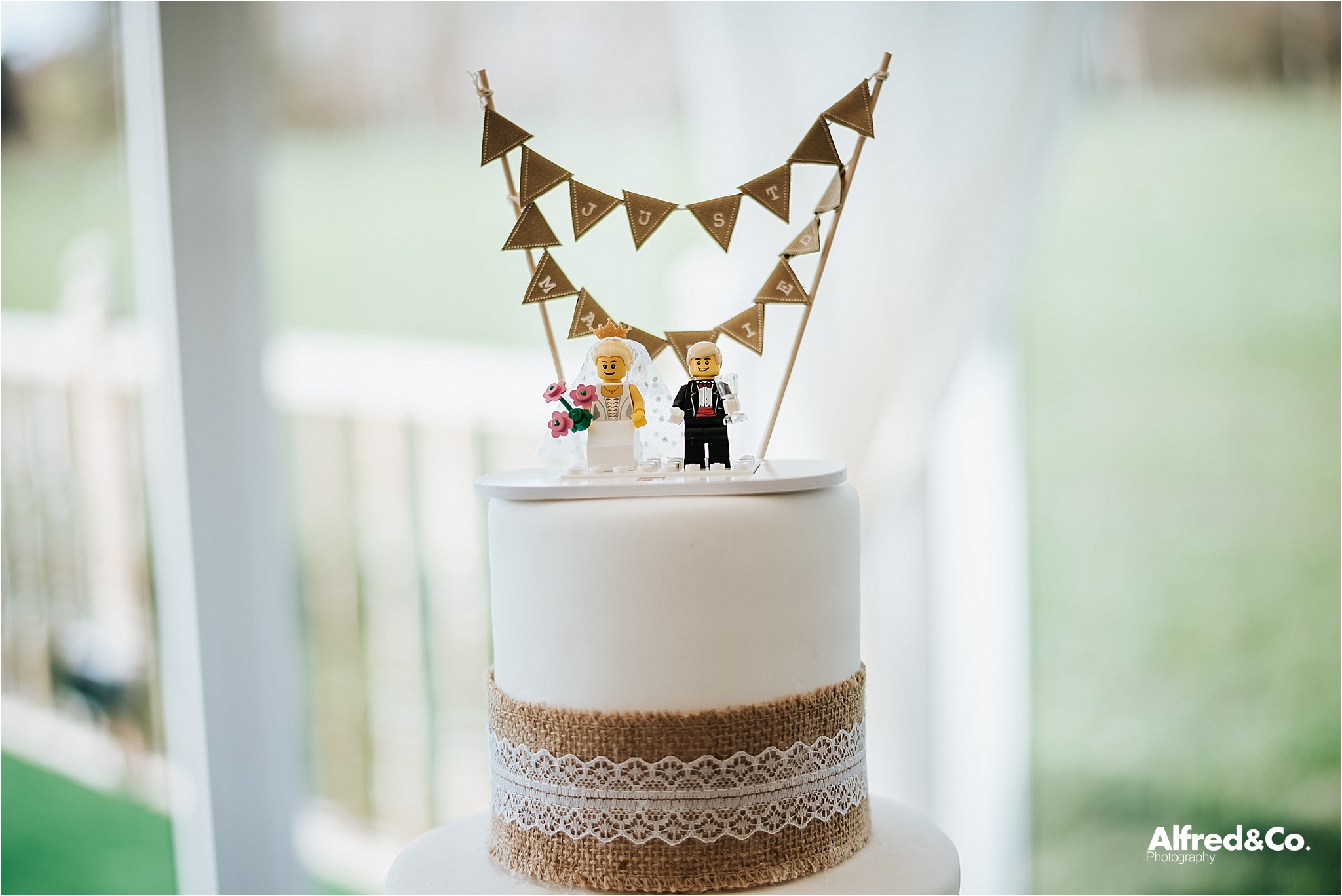 wedding cake with lego cake topper